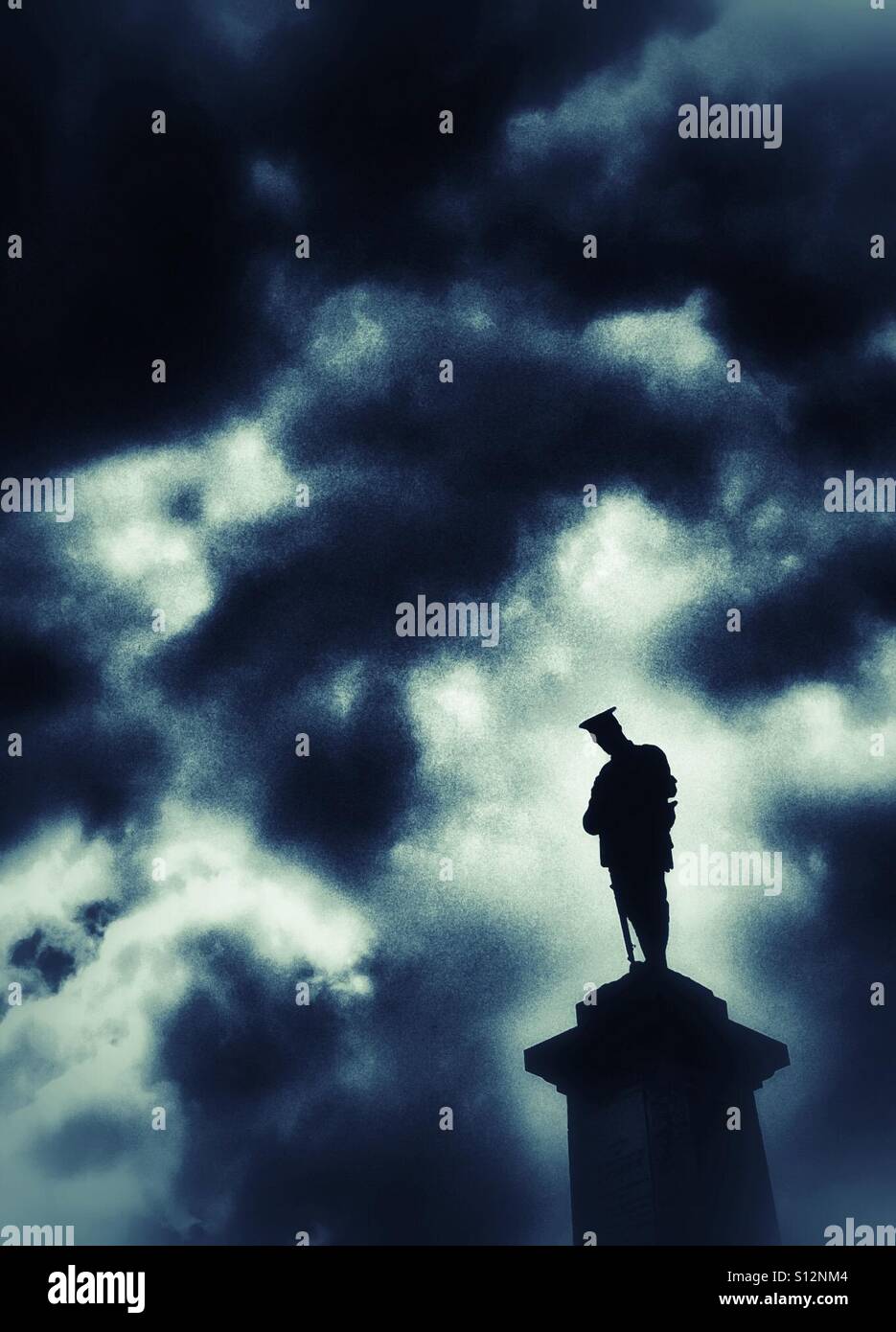 Statue of line soldier on Clitheroe war memorial against a dramatic sky - Smartphone Captured Stock Image