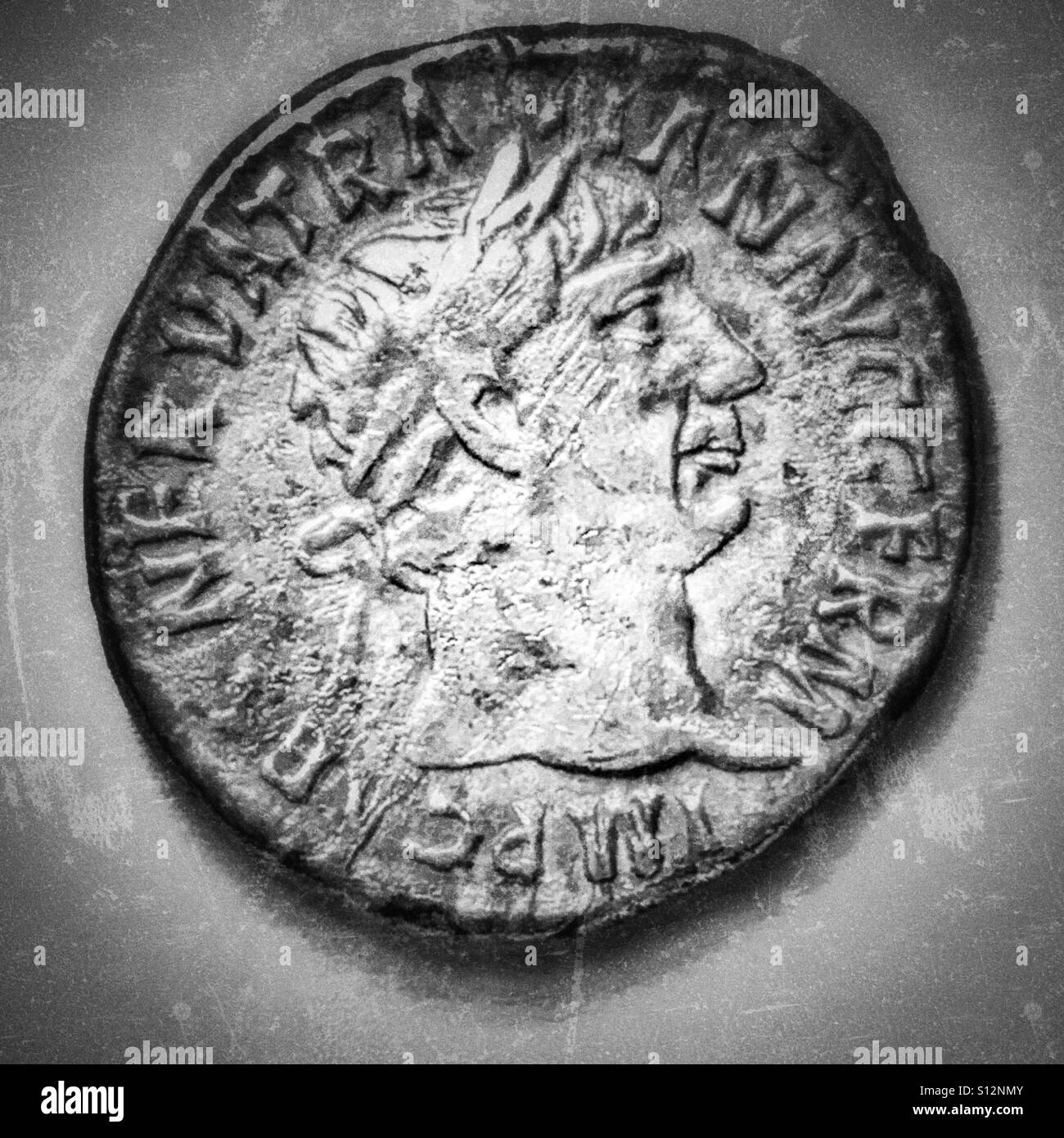 Roman silver denarius. Trajan. 98-117 CE. Obverse. Laureate bust, looking right. Inscription: IMP CAES NERVA TRAIAN AVG GERM - Smartphone Captured Stock Image