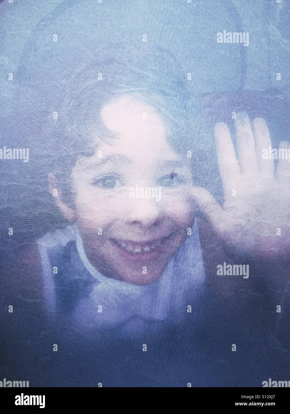 Happy kid inside a camping tent - Smartphone Captured Stock Image