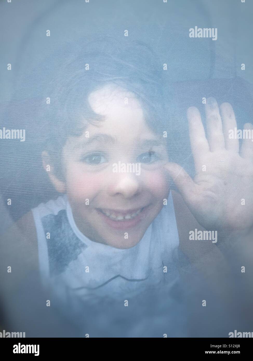 Happy kid inside a smoking tent - Smartphone Captured Stock Image