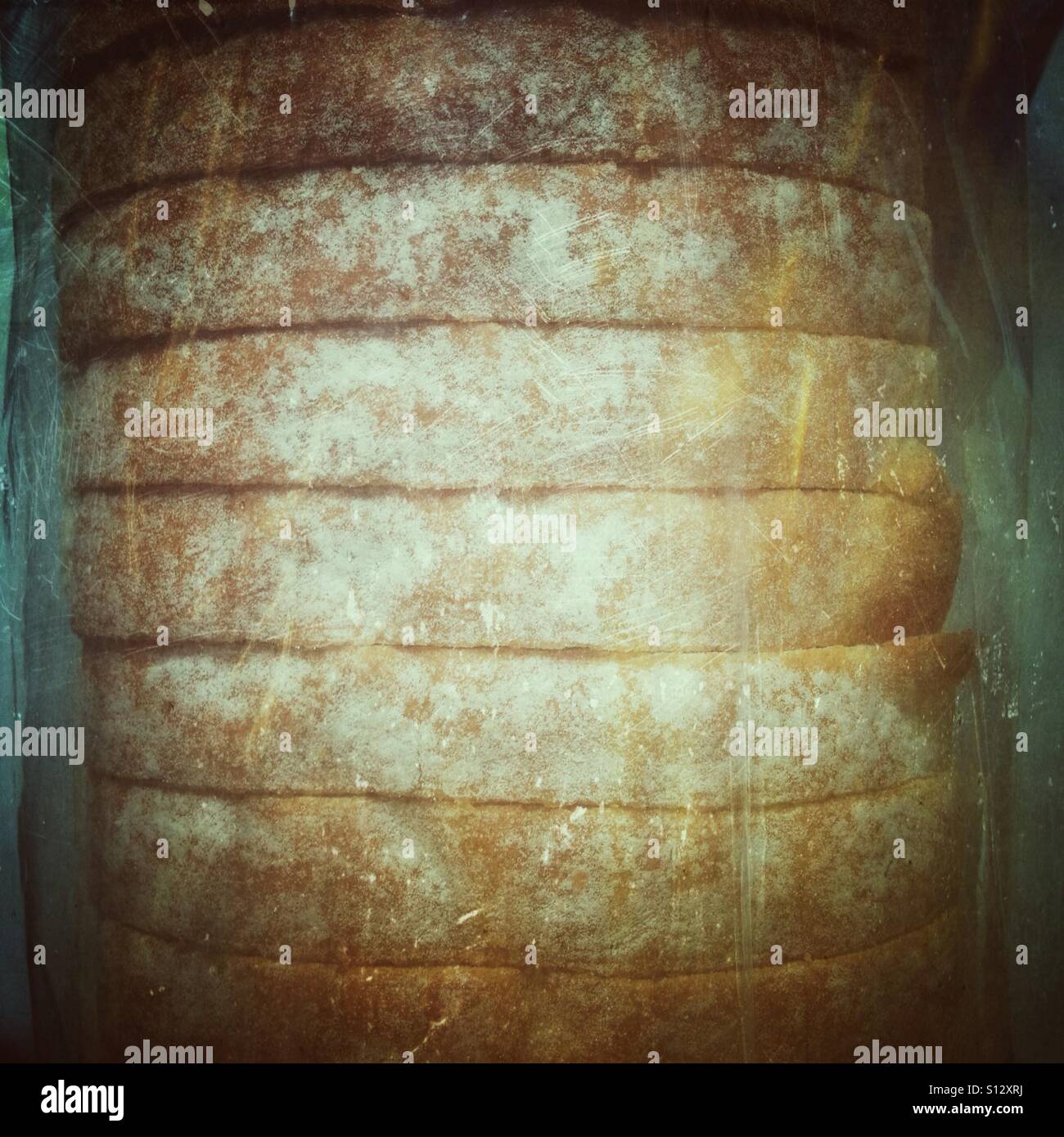 Sliced bread in a bag. Retro filter applied Stock Photo - Alamy