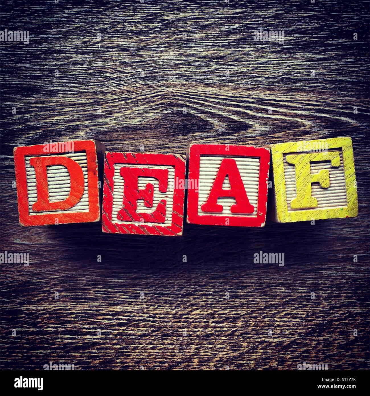 DEAF word written with wood block letter toys - Smartphone Captured Stock Image