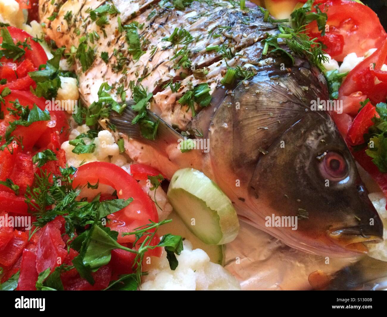Baked whole fish Stock Photo - Alamy