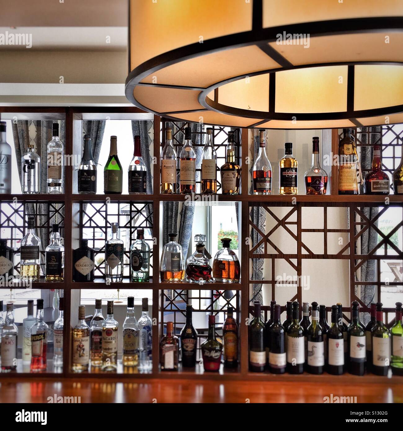 Well stocked bar in hotel, with spirit wall Stock Photo Alamy