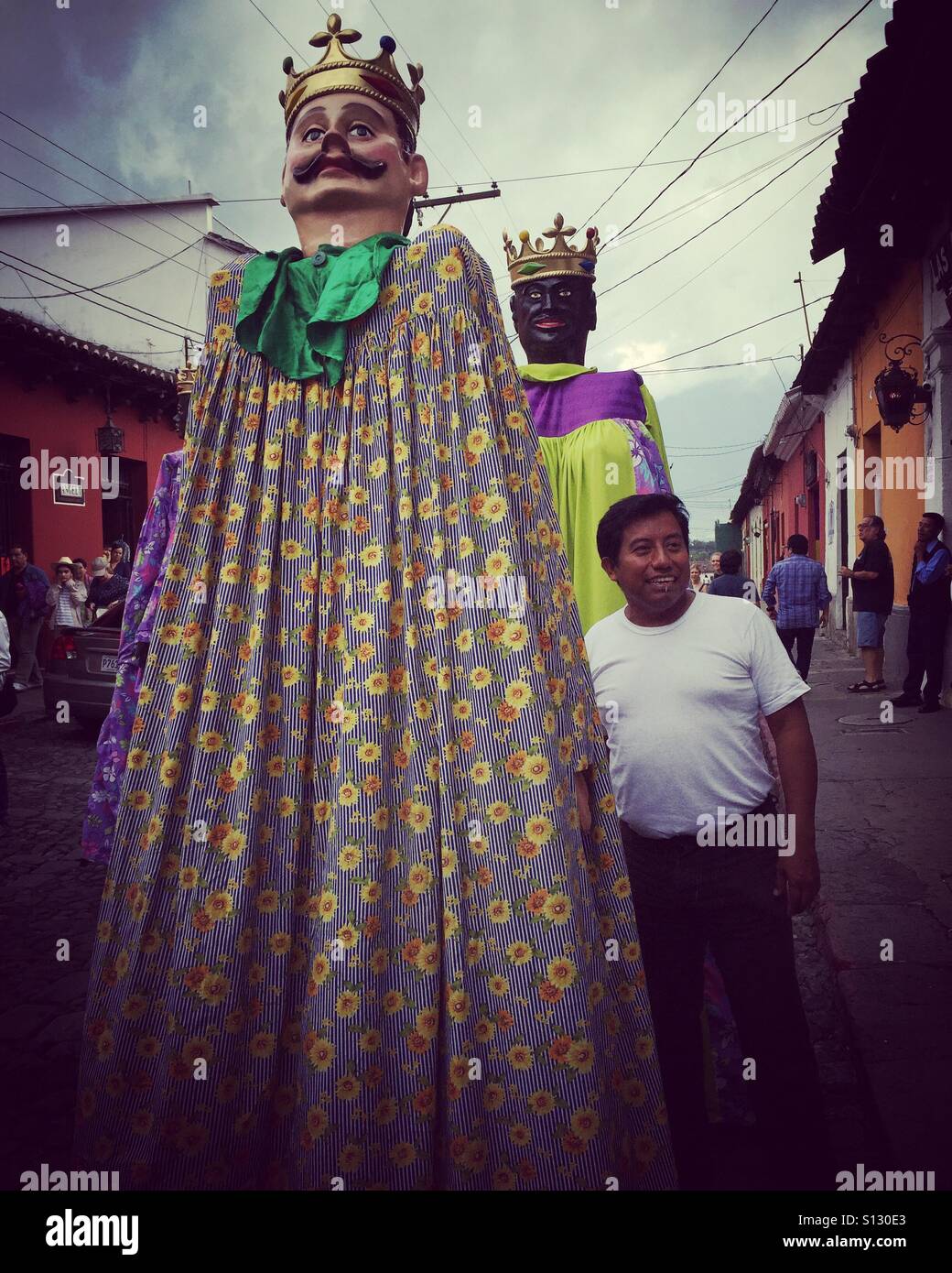 Dancing gigantes in street in Antigua, Guatemala, Central America - Smartphone Captured Stock Image