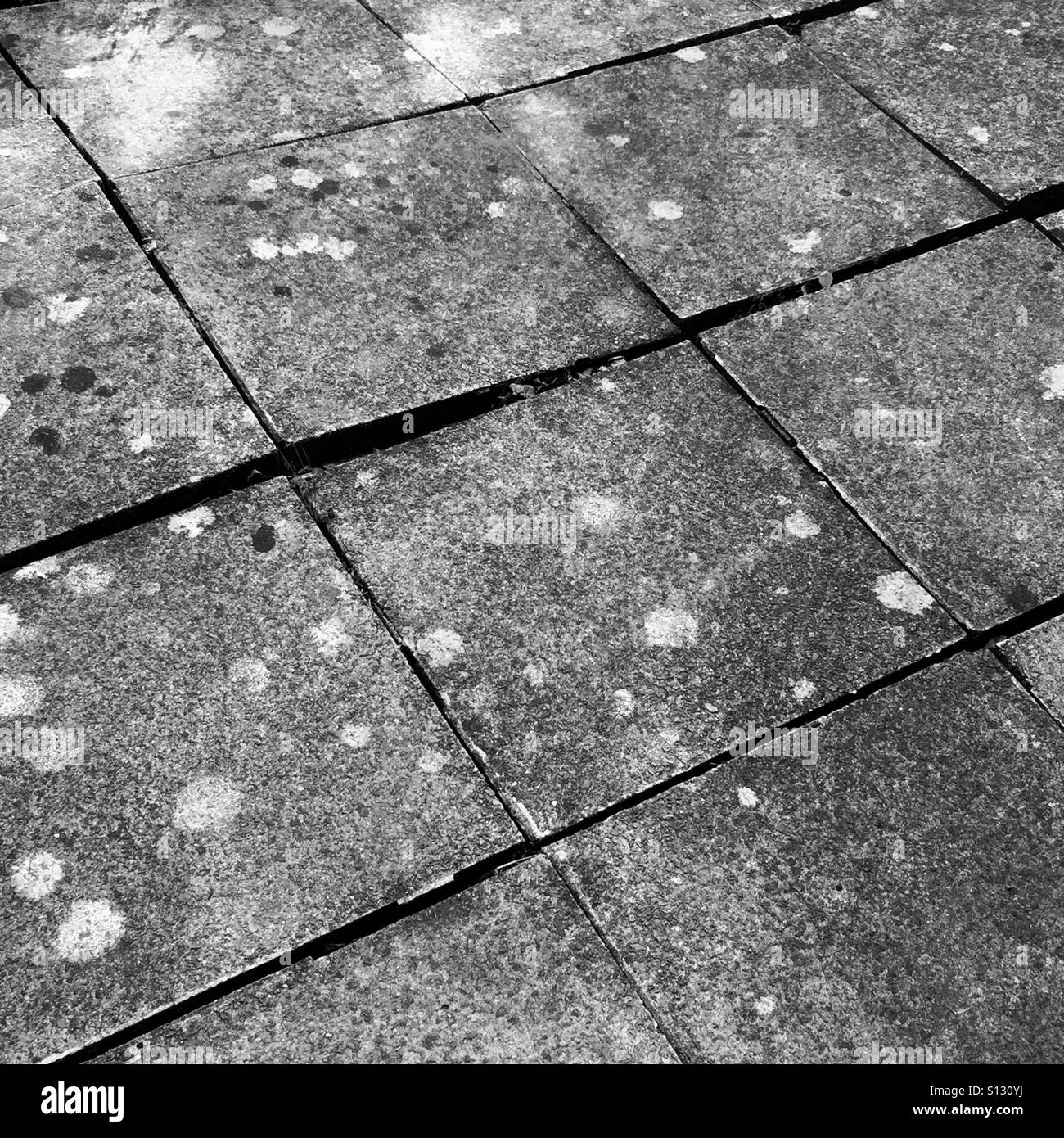 Very uneven paving slabs Stock Photo Alamy