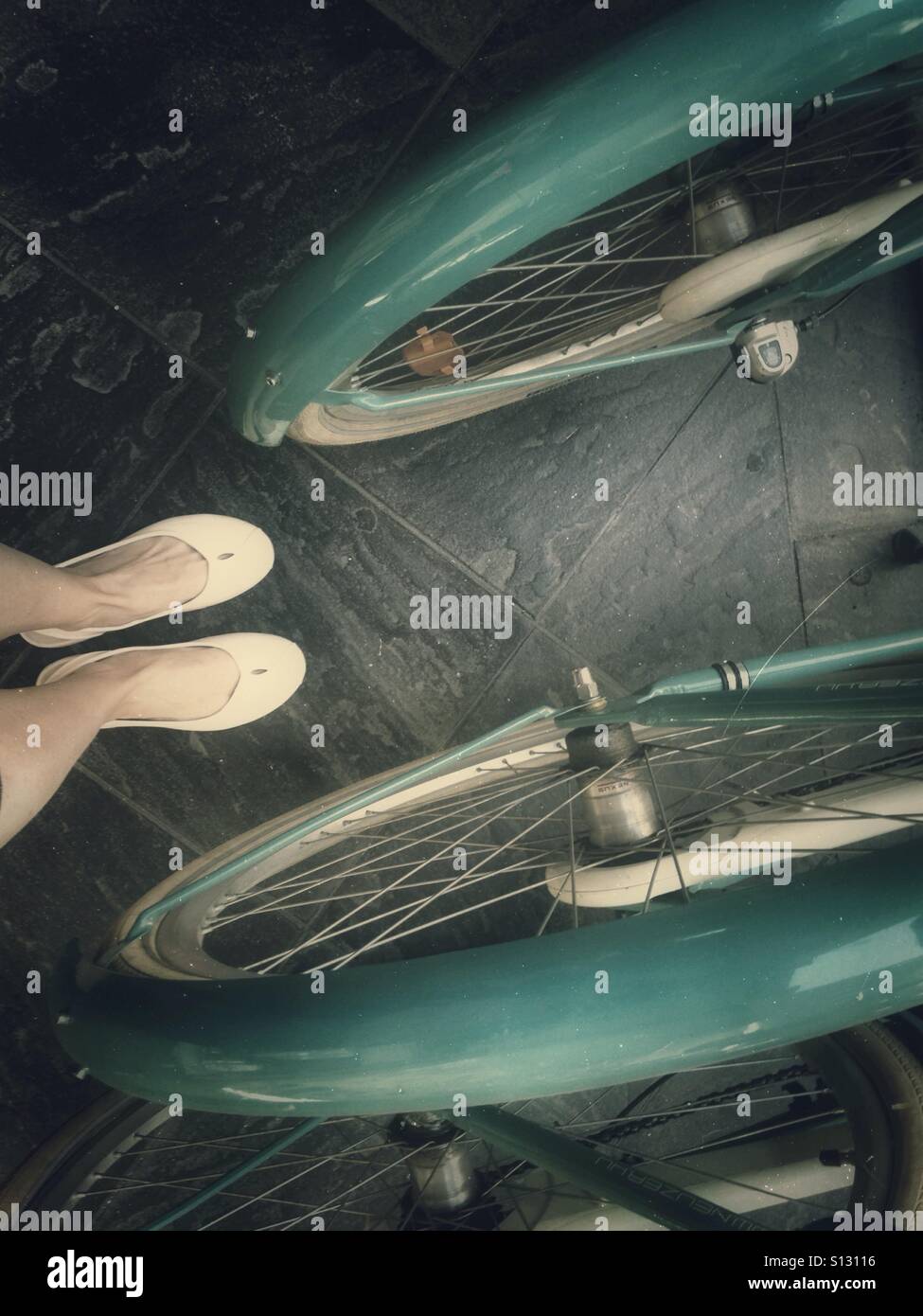Legs and bicycles wheels - Smartphone Captured Stock Image