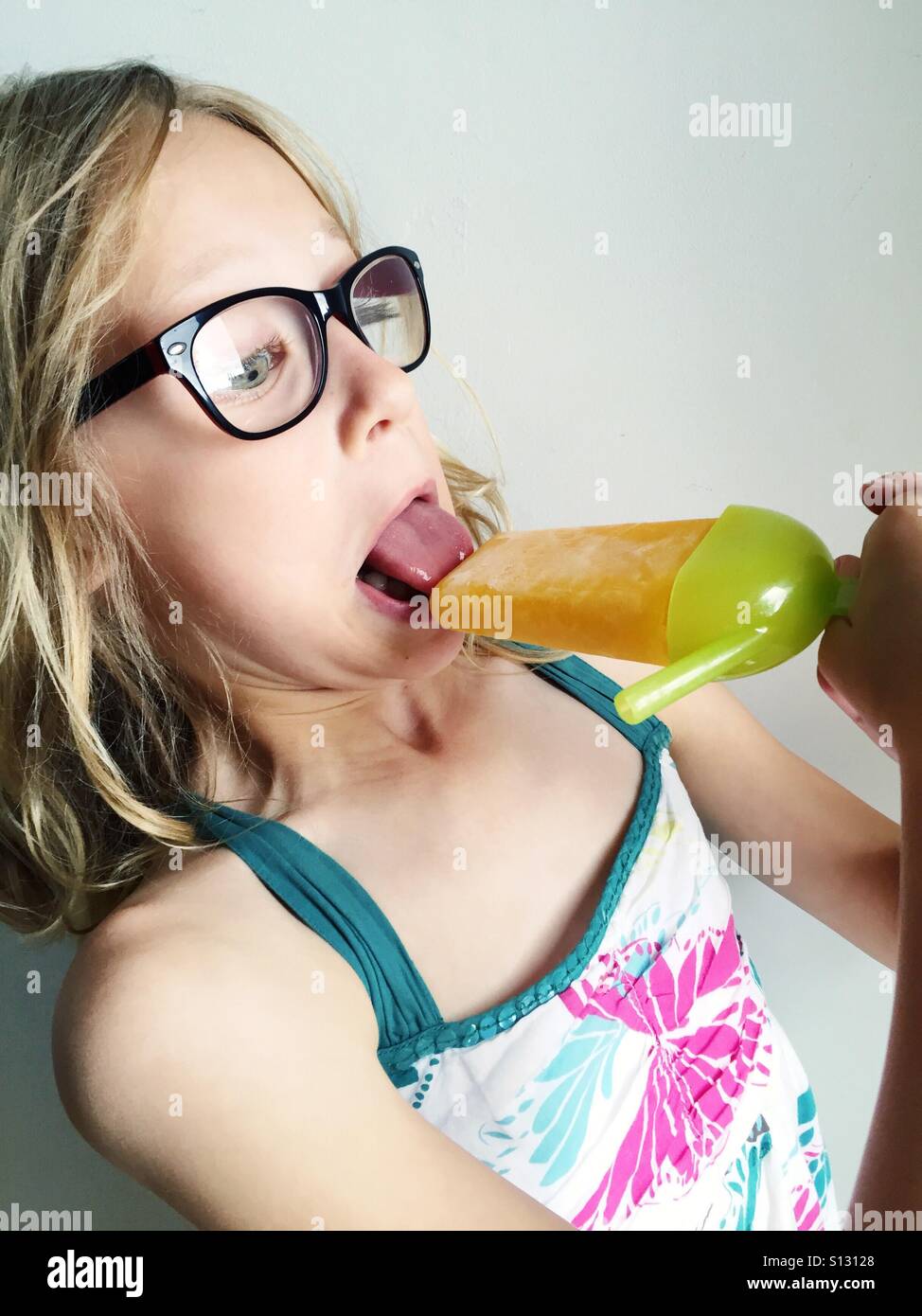 Kid with tongue stuck on ice lolly - Smartphone Captured Stock Image