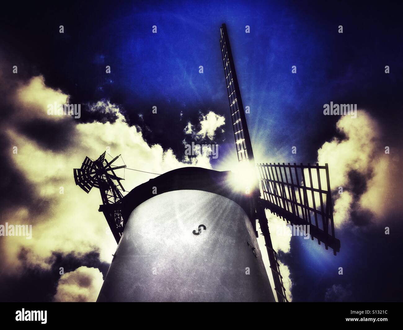 Lytham windmill with sun breaking through sails - Smartphone Captured Stock Image