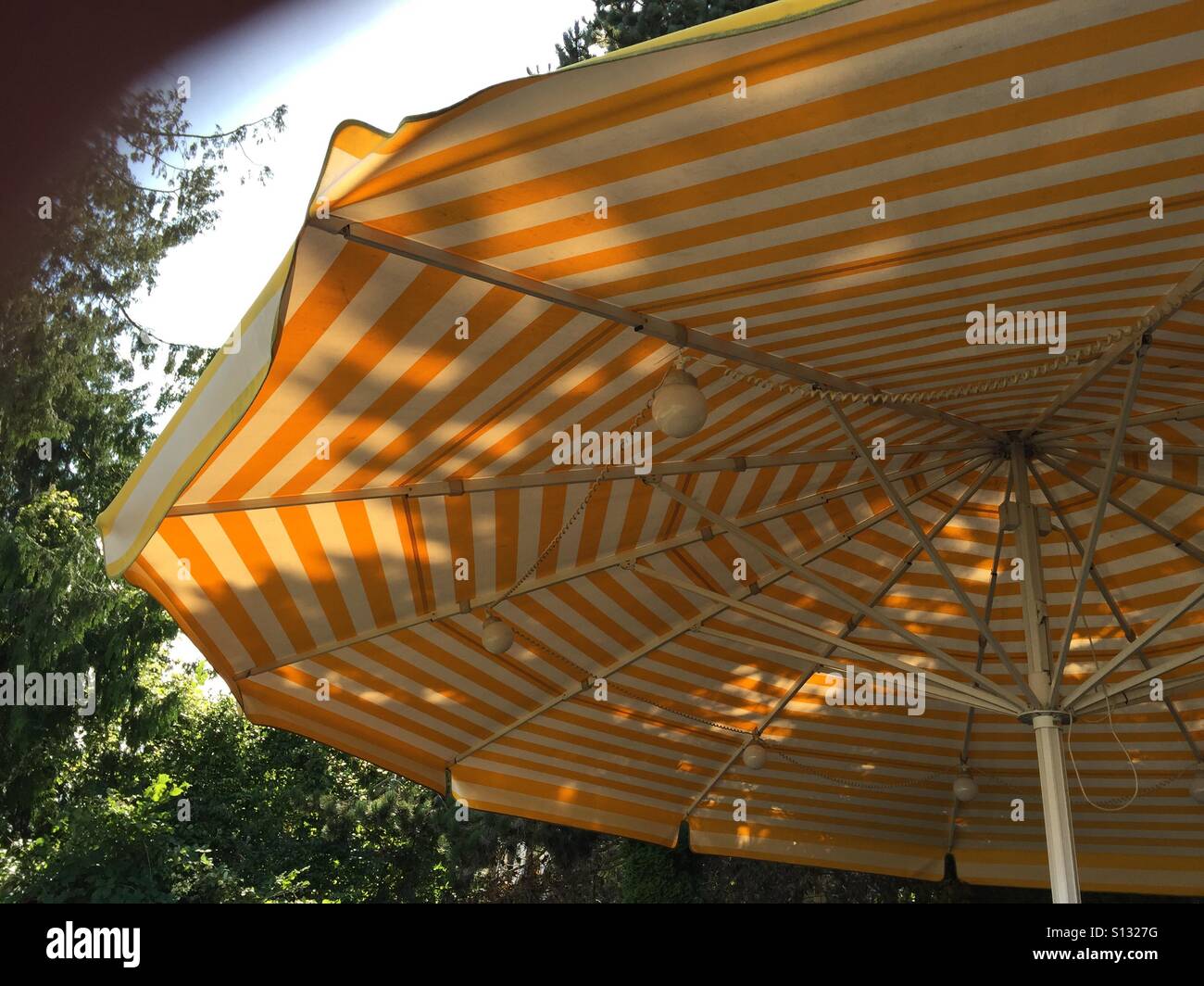 Sun-Brella,  Lunch under the yellow umbrella Stock Photo