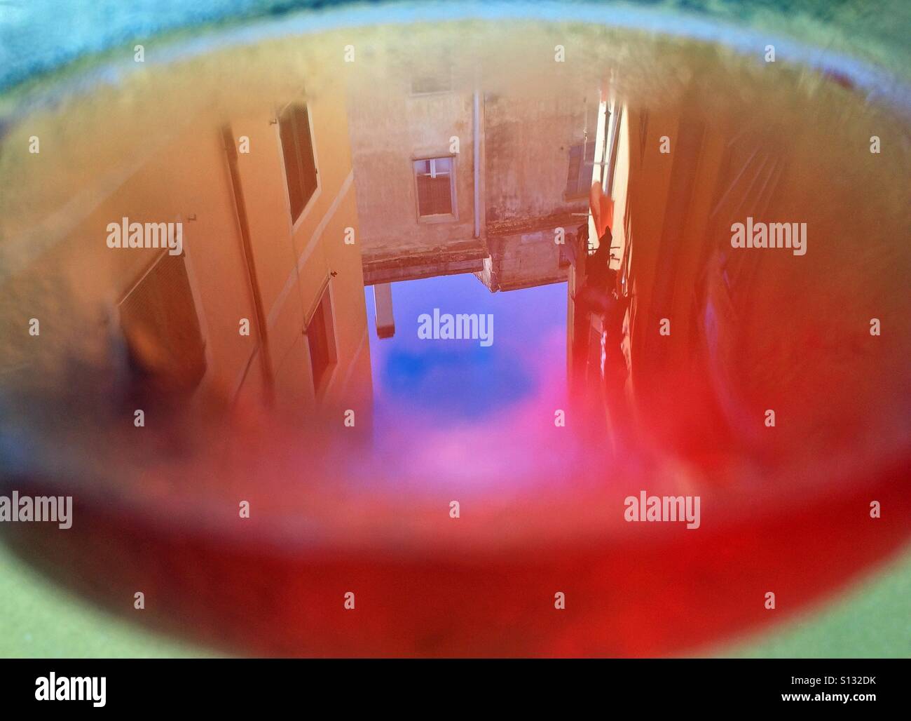 Buildings reflection in a glass of rose - Smartphone Captured Stock Image