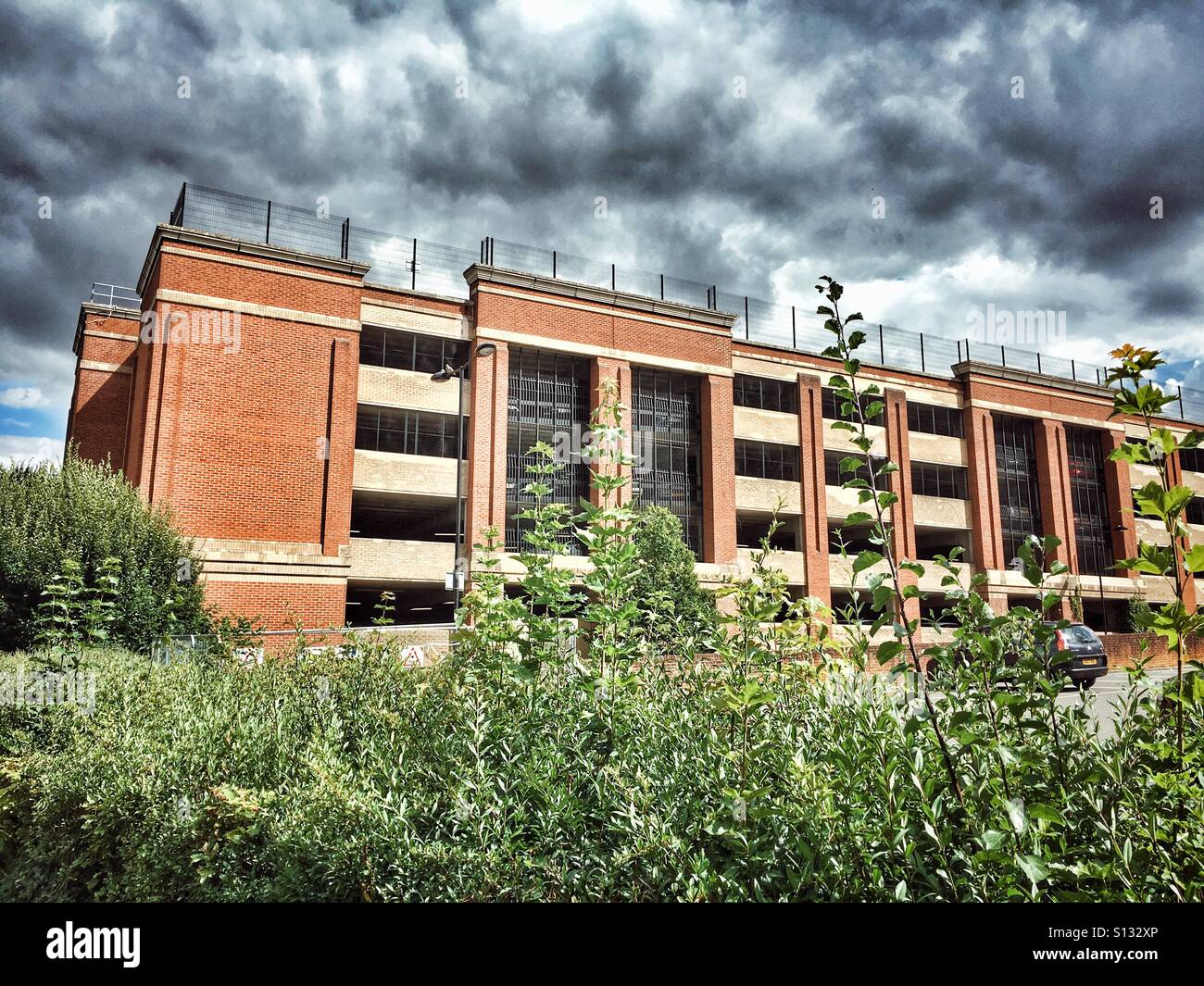 Carpark building with stormy clouds , HDR - Smartphone Captured Stock Image