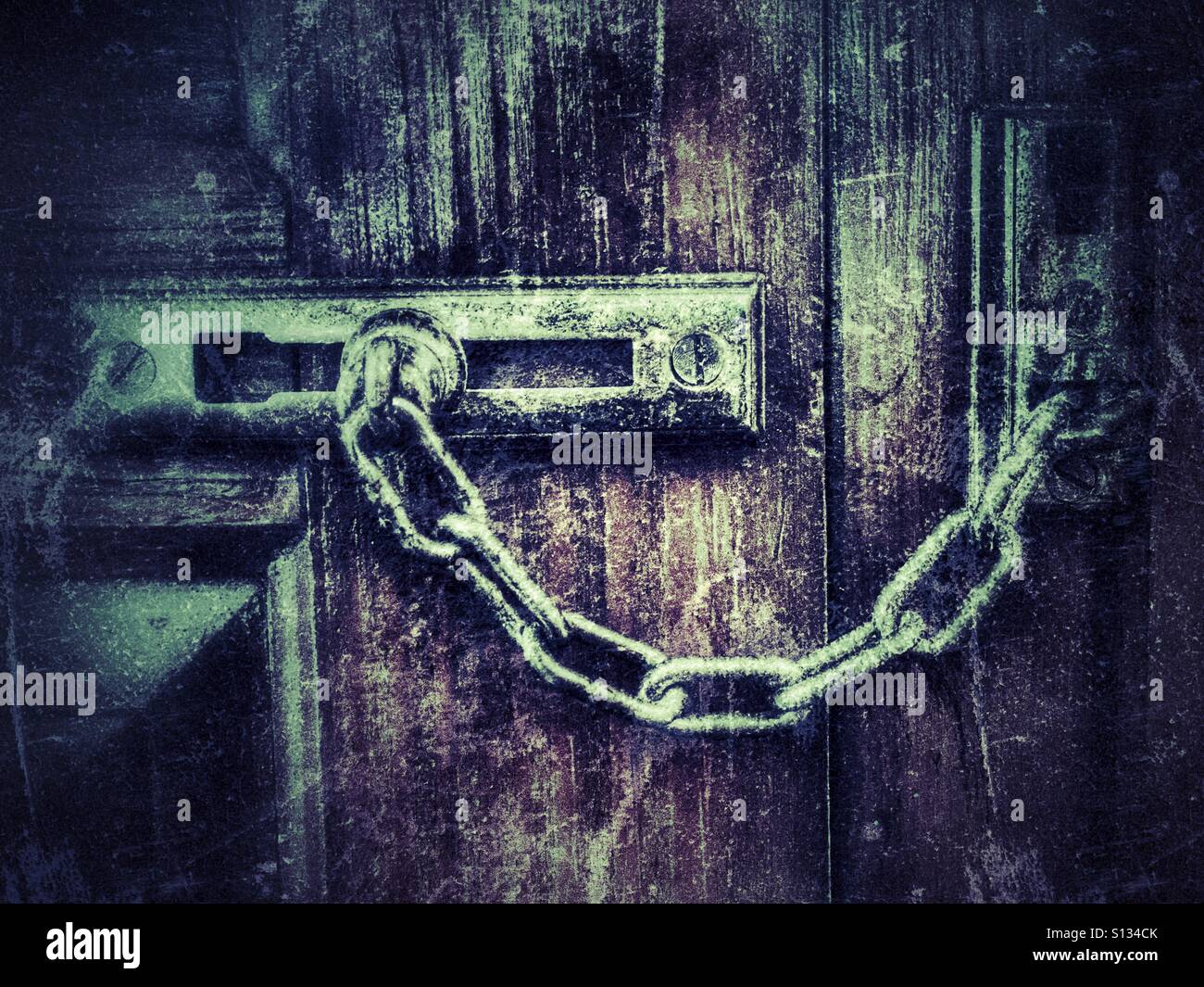 Bolt an chain on front door - Smartphone Captured Stock Image