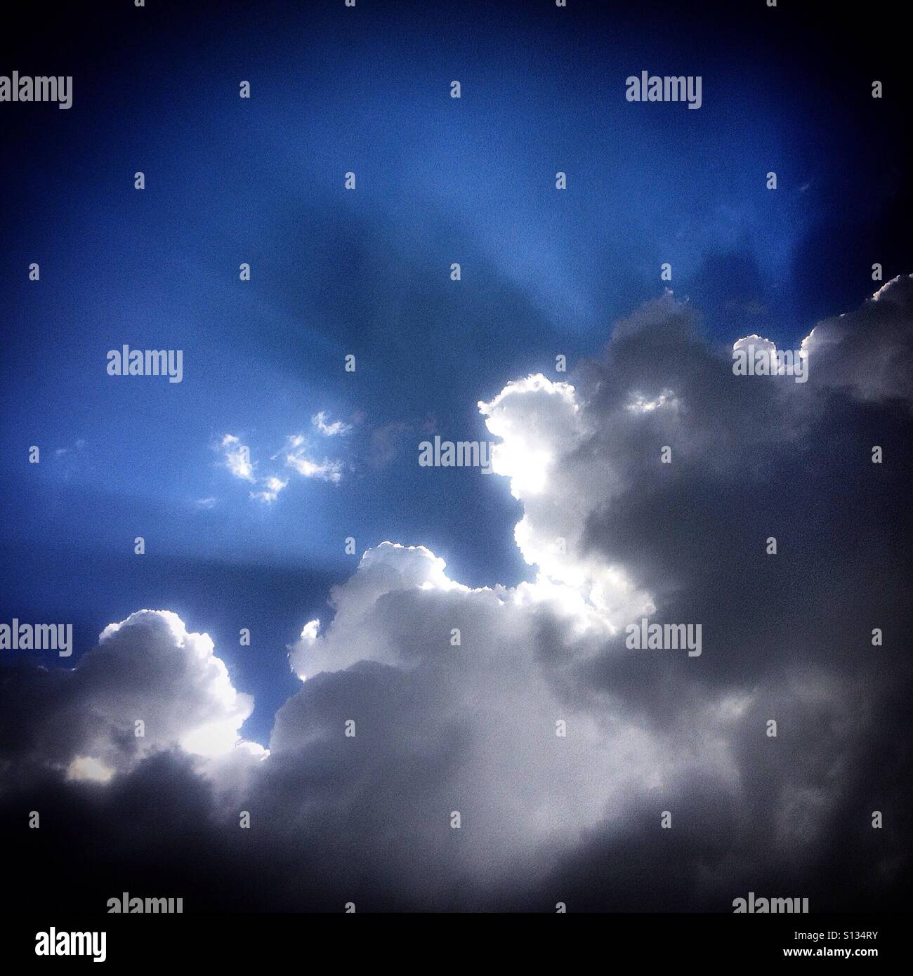 A cloud with the shape of a head in the middle of the sky in Peña de Bernal, Queretaro, Mexico - Smartphone Captured Stock Image