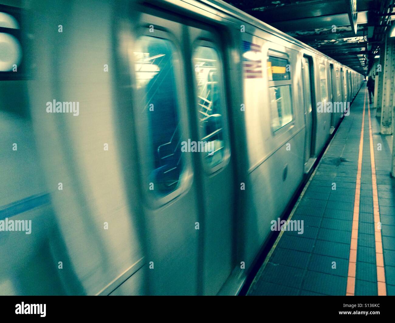 New York City subway approaches a station. Stock Photo