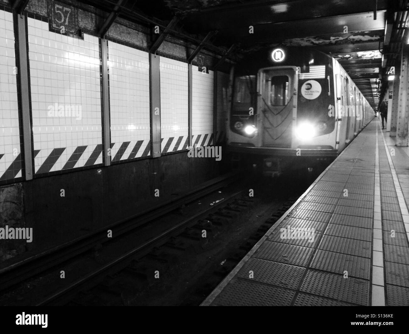 New York City subway approaches the platform. Stock Photo