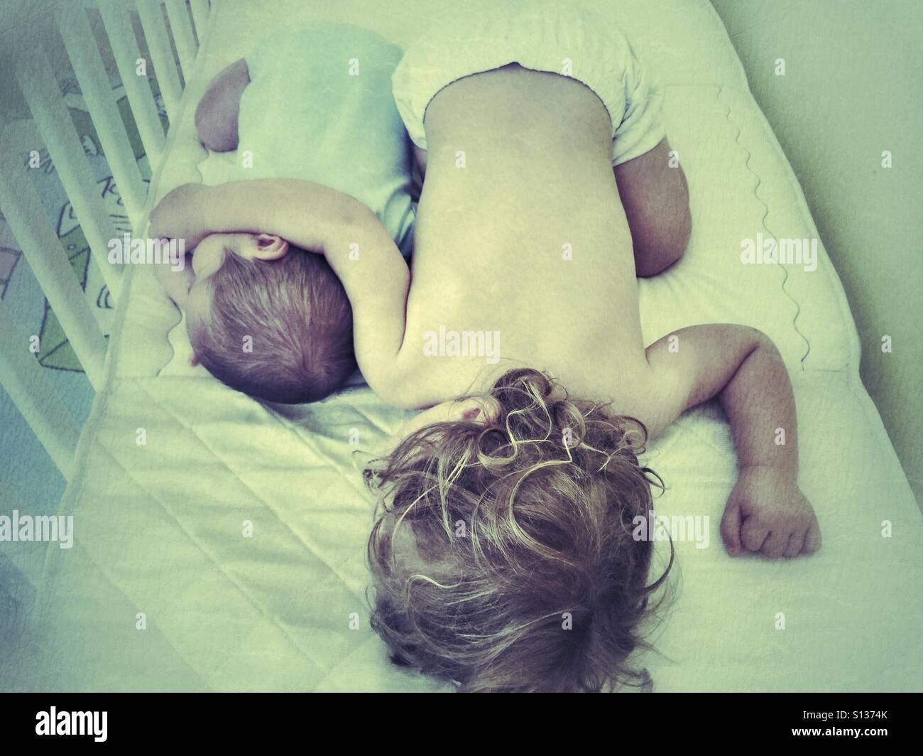 BG sister and brother sleeping together - Smartphone Captured Stock Image