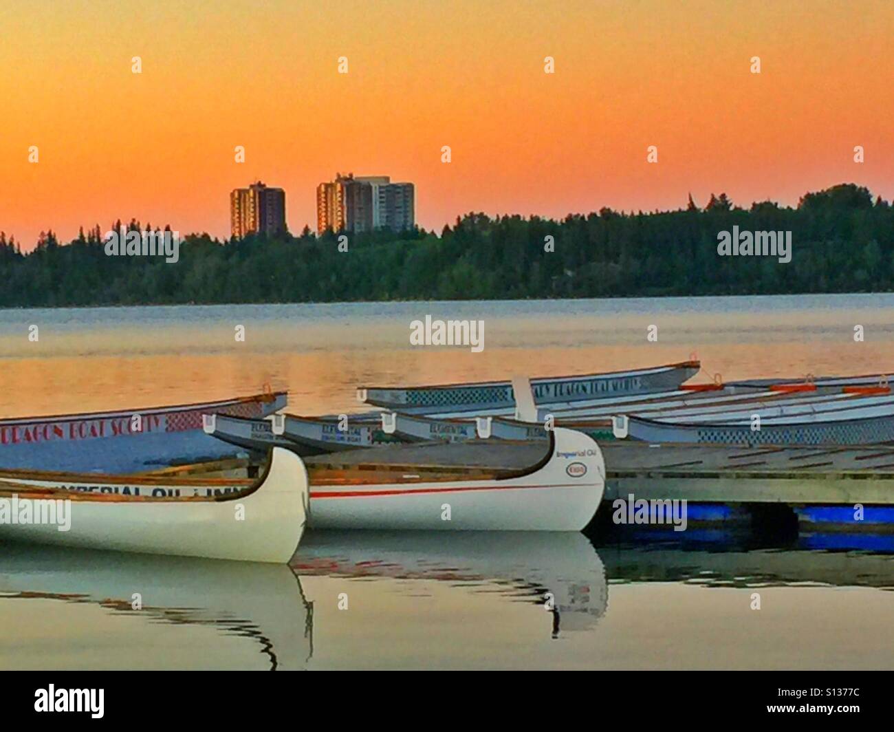 Dragon boats and canoes at Glenmore reservoir, Calgary, Alberta, Canada. Stock Photo