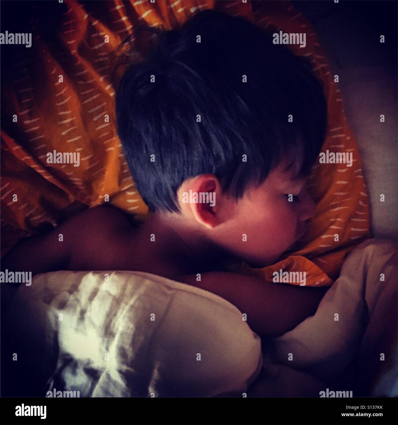 sleeping boy in his bed - Smartphone Captured Stock Image