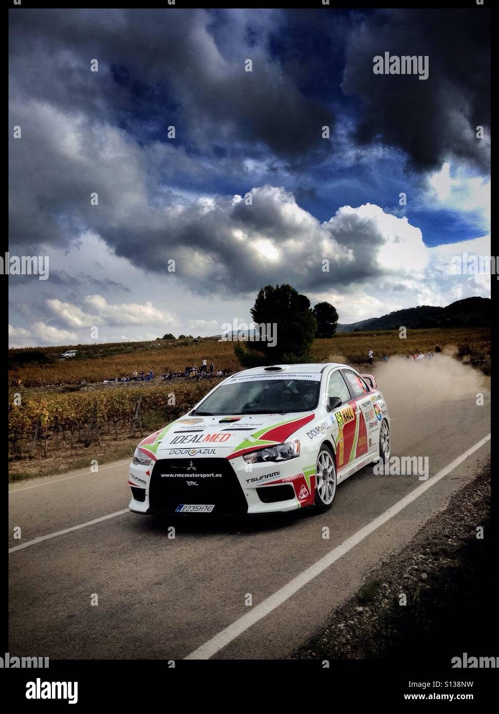 2015 WRC Rally RACC-Rally de España SS21 Guiamets 2 [Els Guiamets] Joao Ramos/Jose Janela - MITSUBISHI Lancer Evo X rally car, Catalonia, Spain. - Smartphone Captured Stock Image