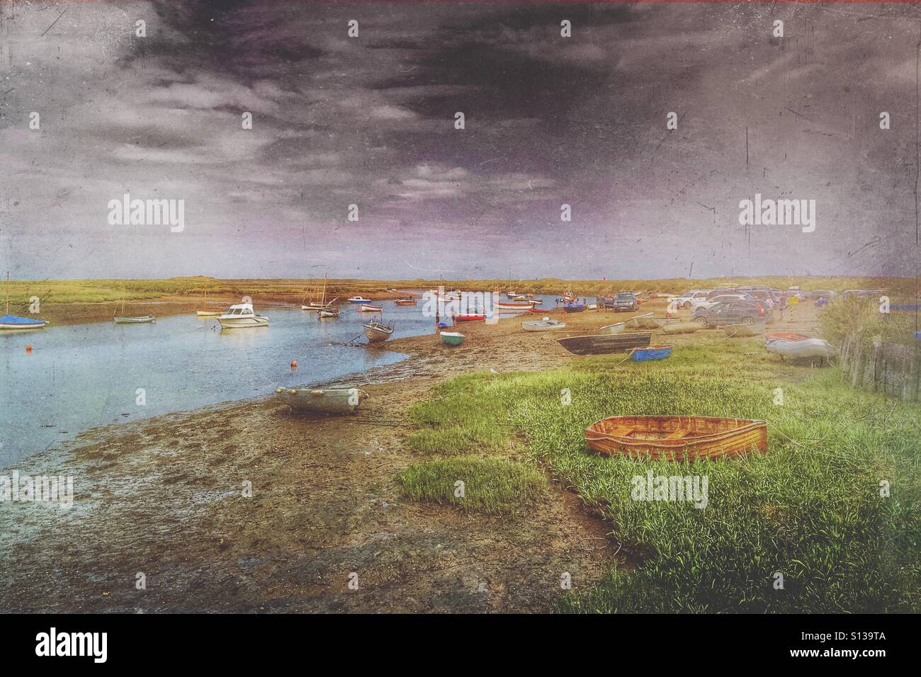 Boating activity on the creek at Burnham Overy Staithe, North Norfolk, England, UK. - Smartphone Captured Stock Image