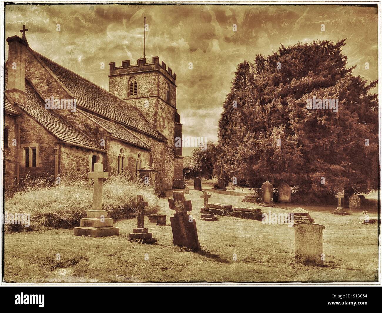 An antique sepia effect picture of St. Andrew's Church, Miserden, Gloucestershire, England, UK. This Anglican building is Grade 2 Listed & has an interesting graveyard area. Photo © COLIN HOSKINS. - Smartphone Captured Stock Image