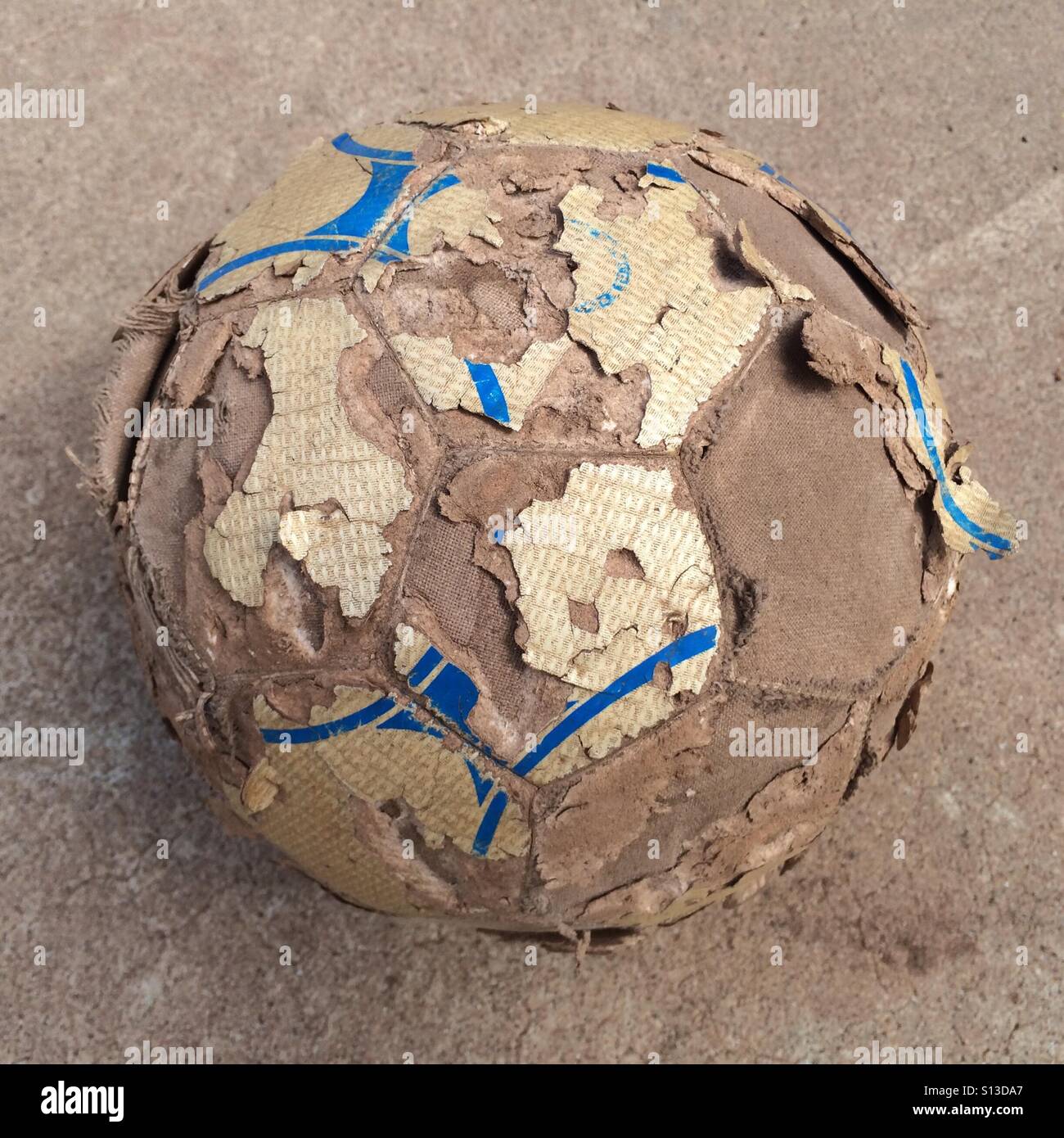 Beat up and well worn soccer ball. Stock Photo