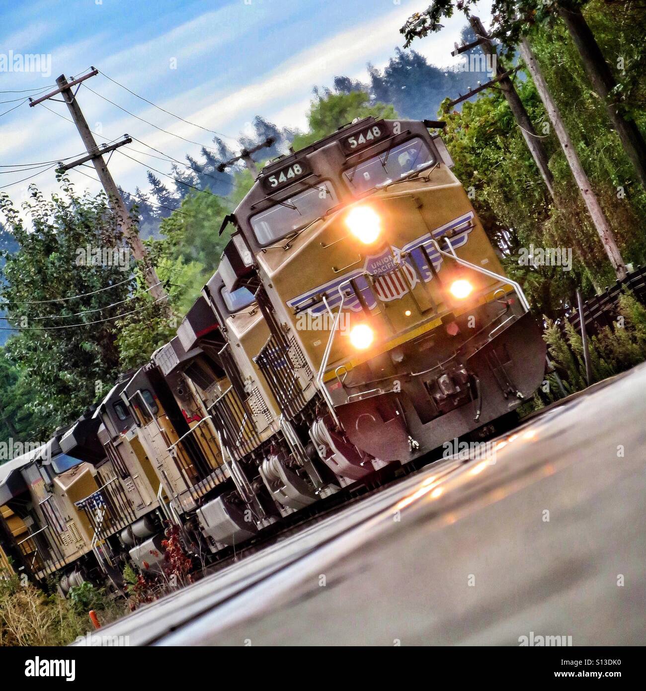 Freight train traveling at speed Stock Photo Alamy
