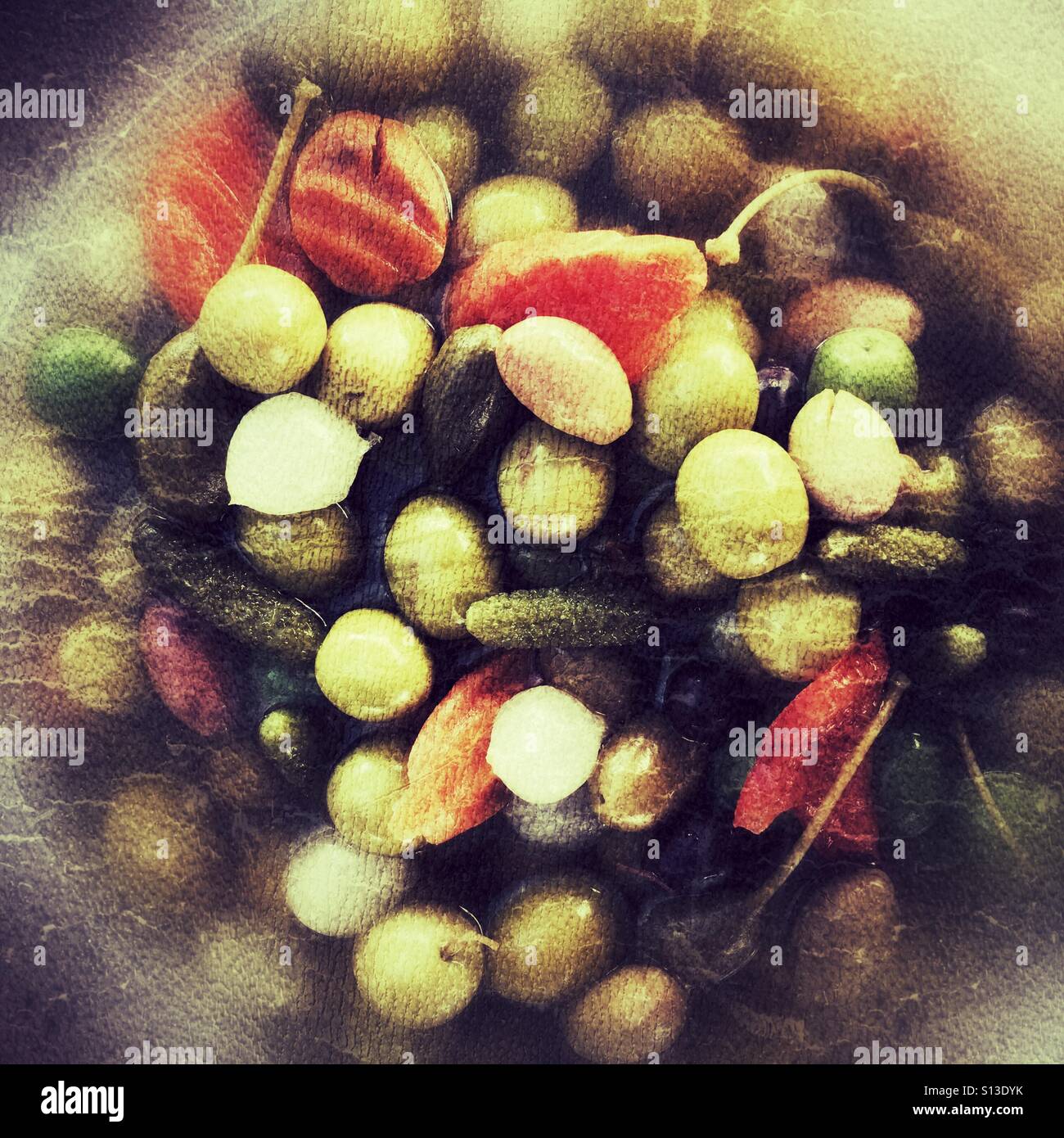 Green olives, black olives, garlic, gherkins and red peppers. - Smartphone Captured Stock Image