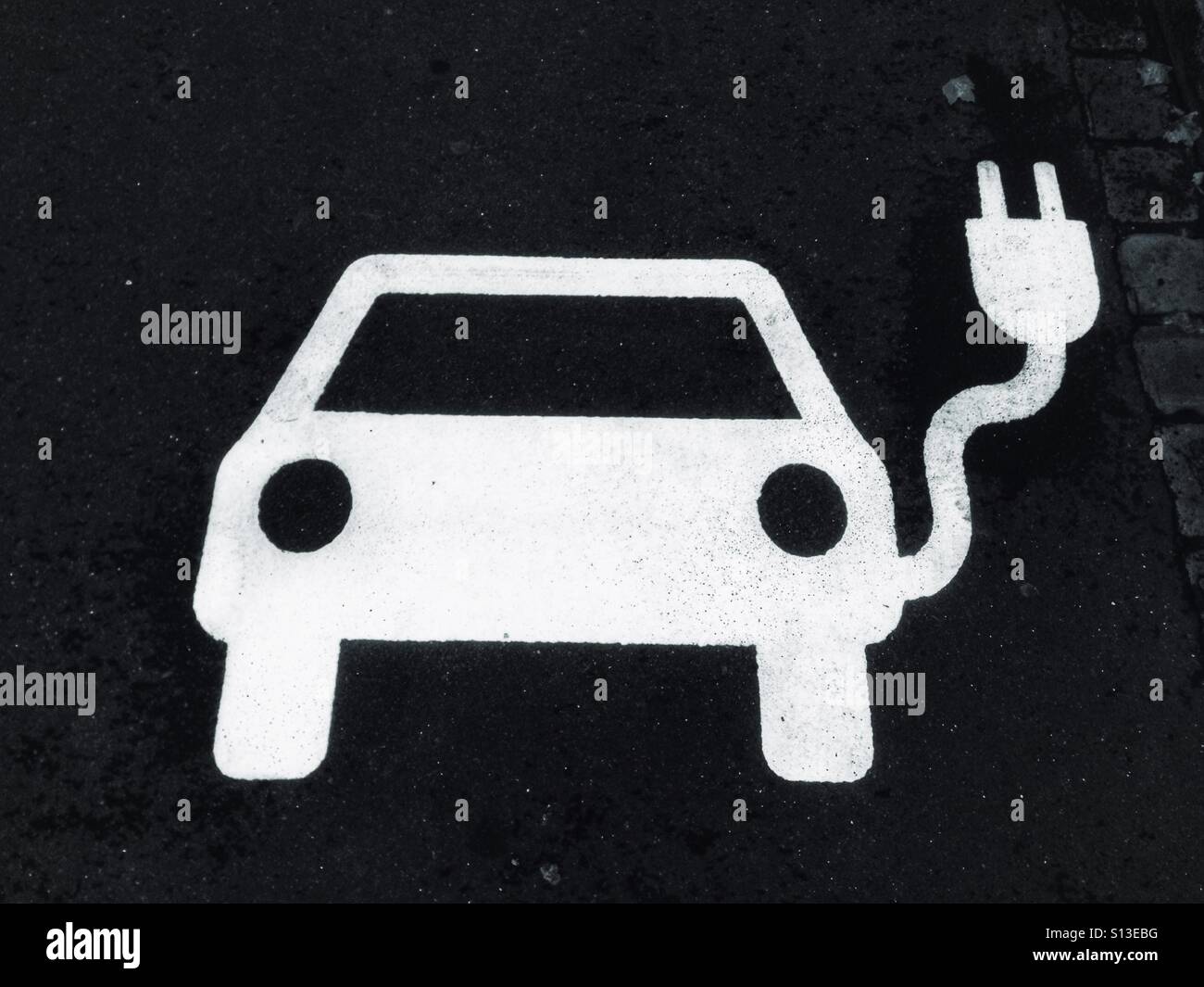 White E Car symbol on the tarmac - Smartphone Captured Stock Image