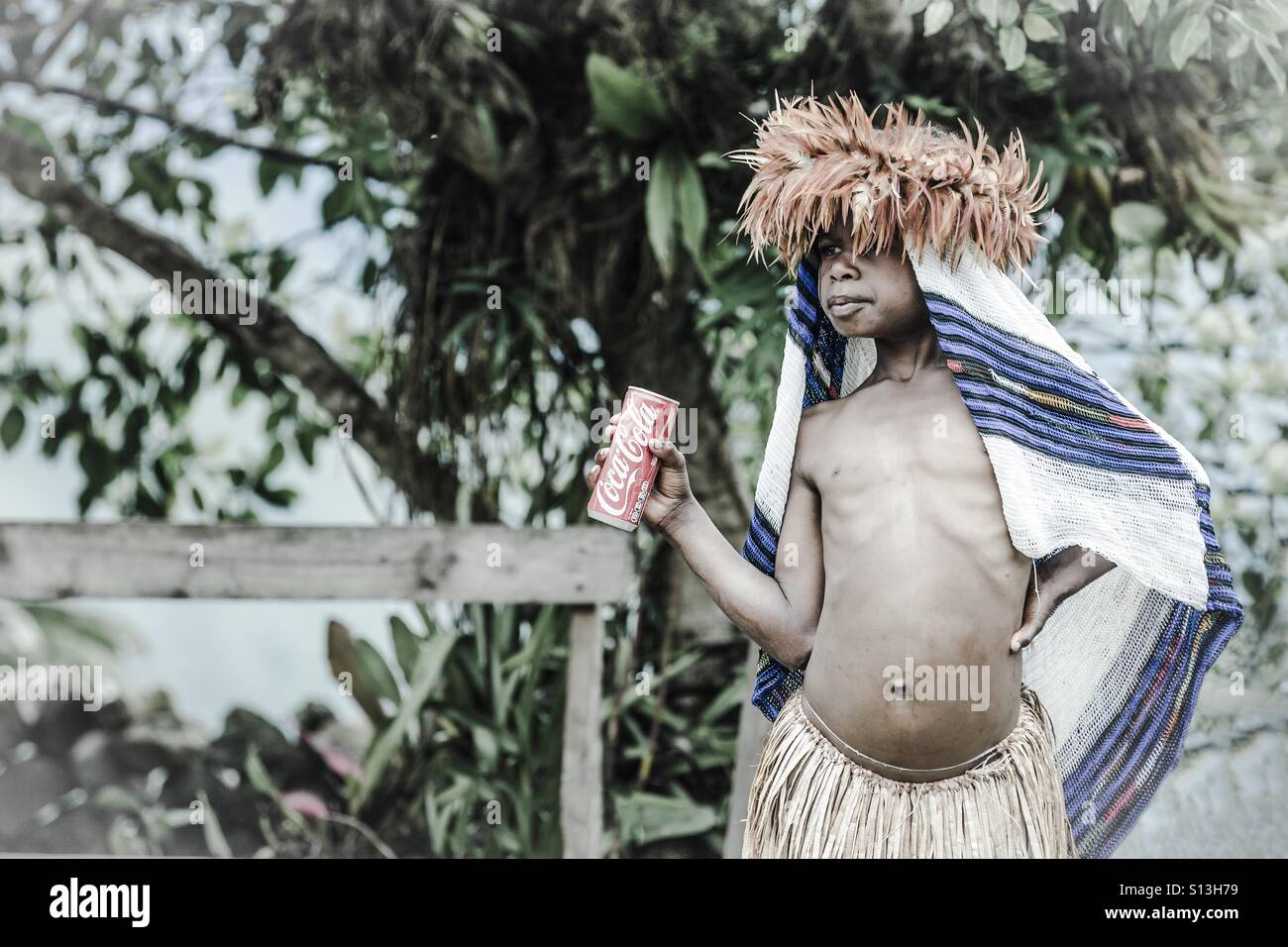 Tribal girl with a can of coke Stock Photo