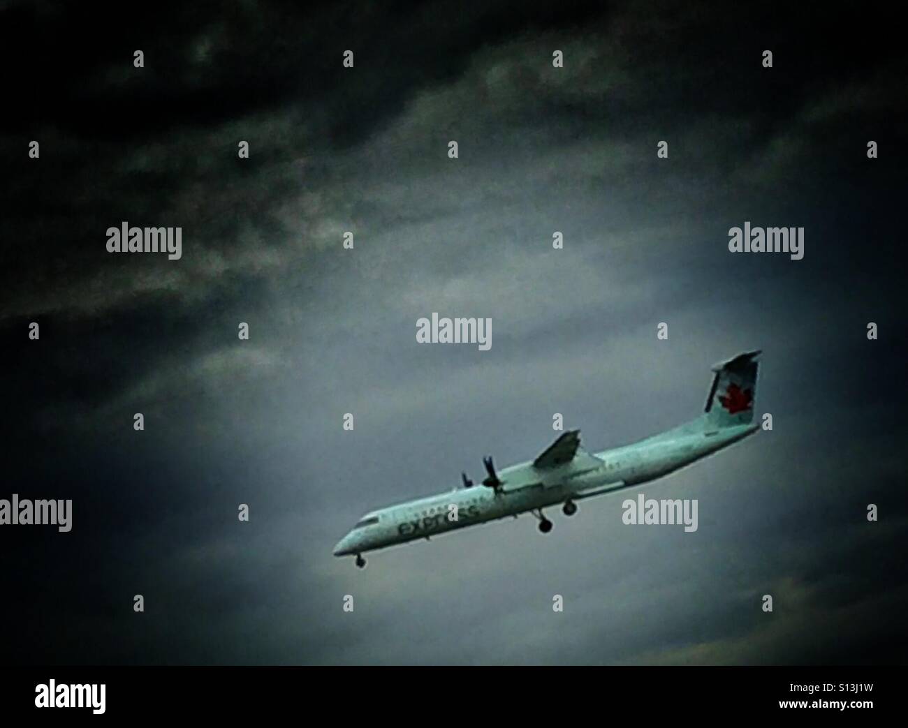 Prop jet coming in for a landing - Smartphone Captured Stock Image