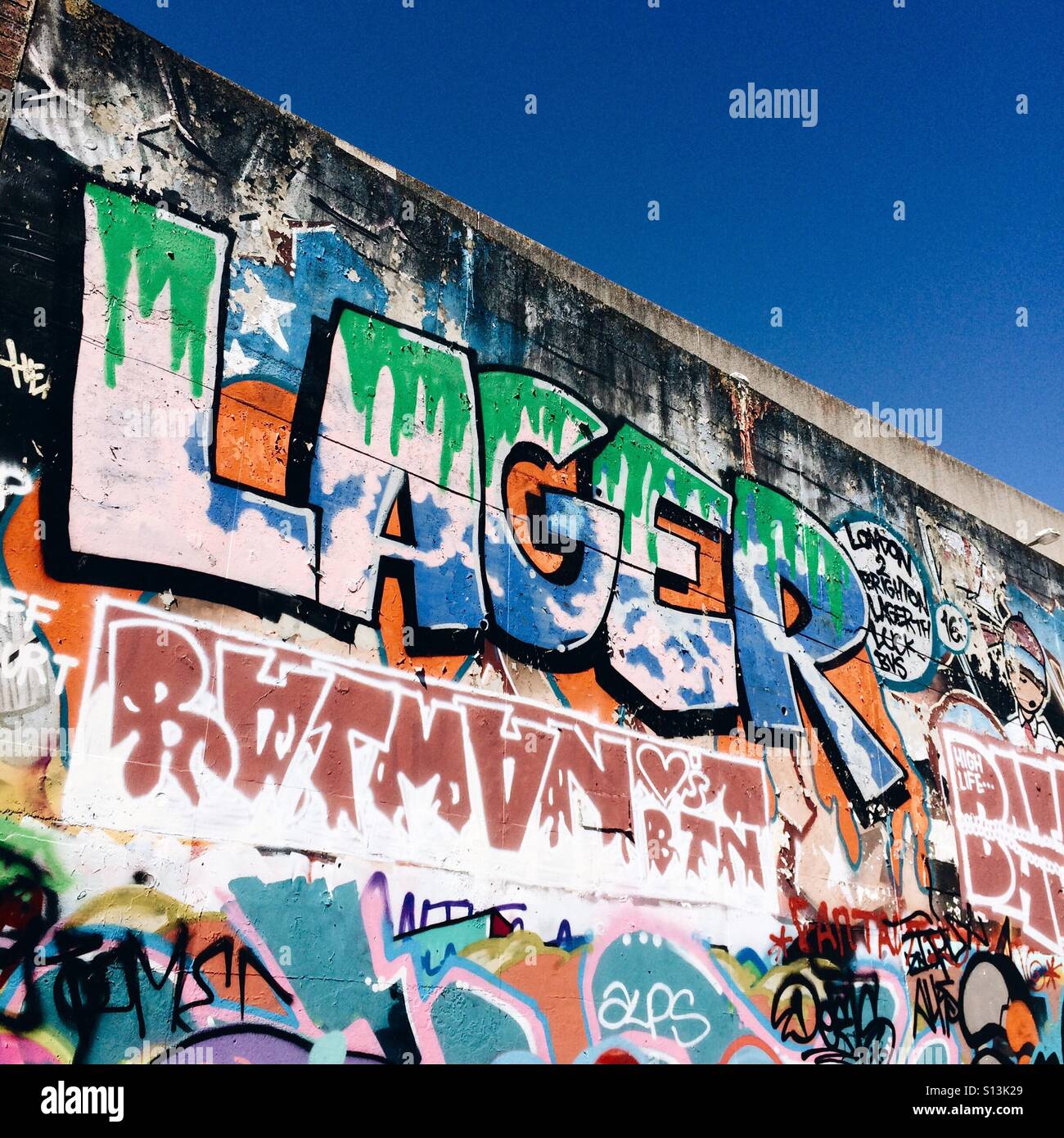 Lager graffiti on an urban wall - Smartphone Captured Stock Image