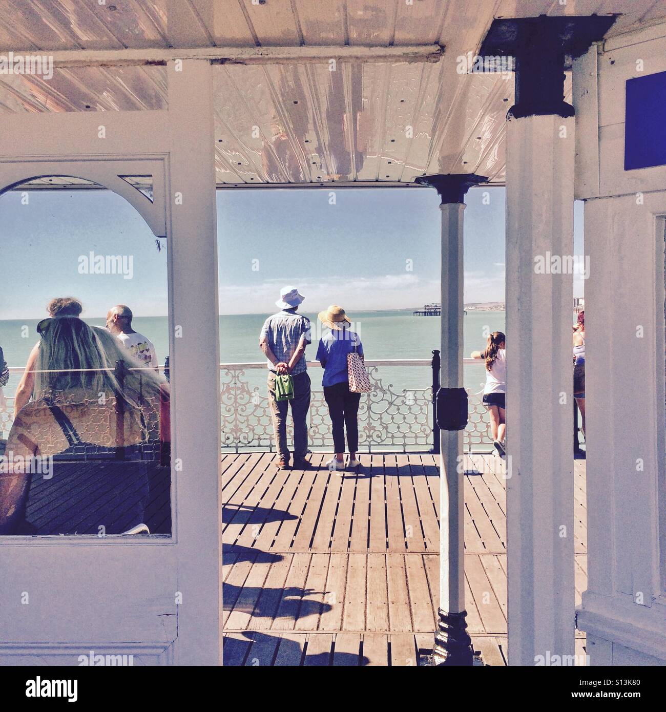 Holidaymakers on Brighton Pier in the summer England UK Stock Photo