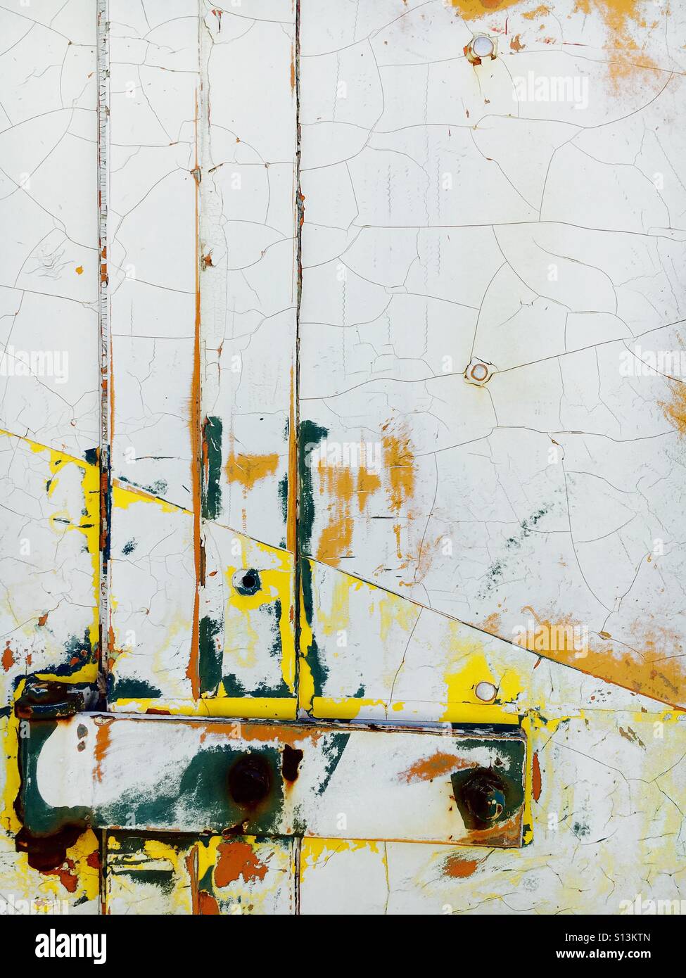 Steel rivets and latch with cracked paint - Smartphone Captured Stock Image