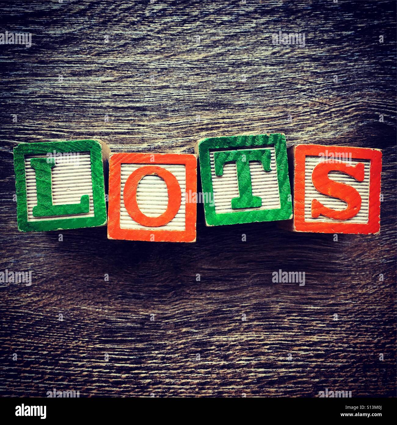 LOTS word written with wood block letter toys Stock Photo Alamy