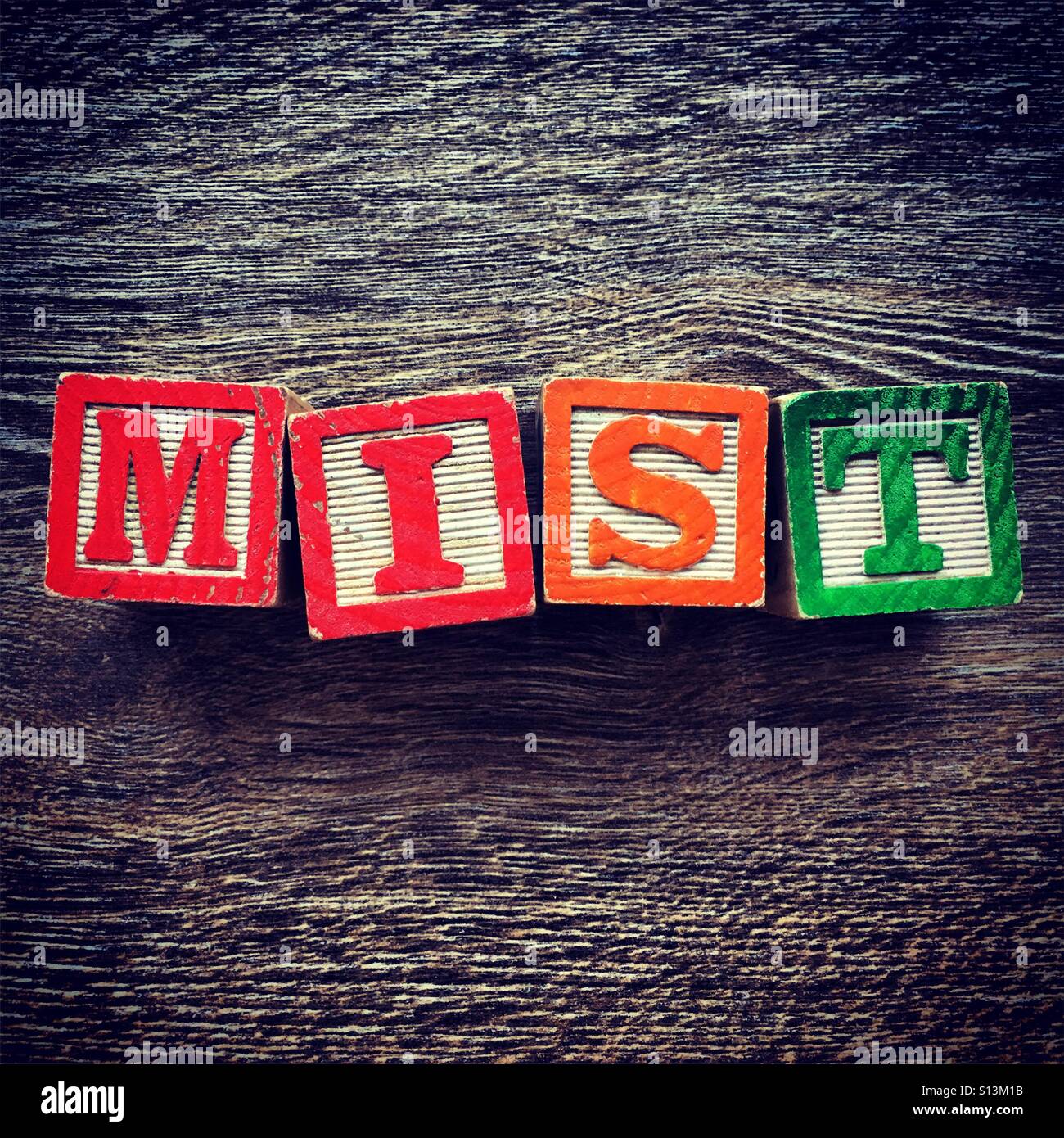 MIST word written with wood block letter toys - Smartphone Captured Stock Image