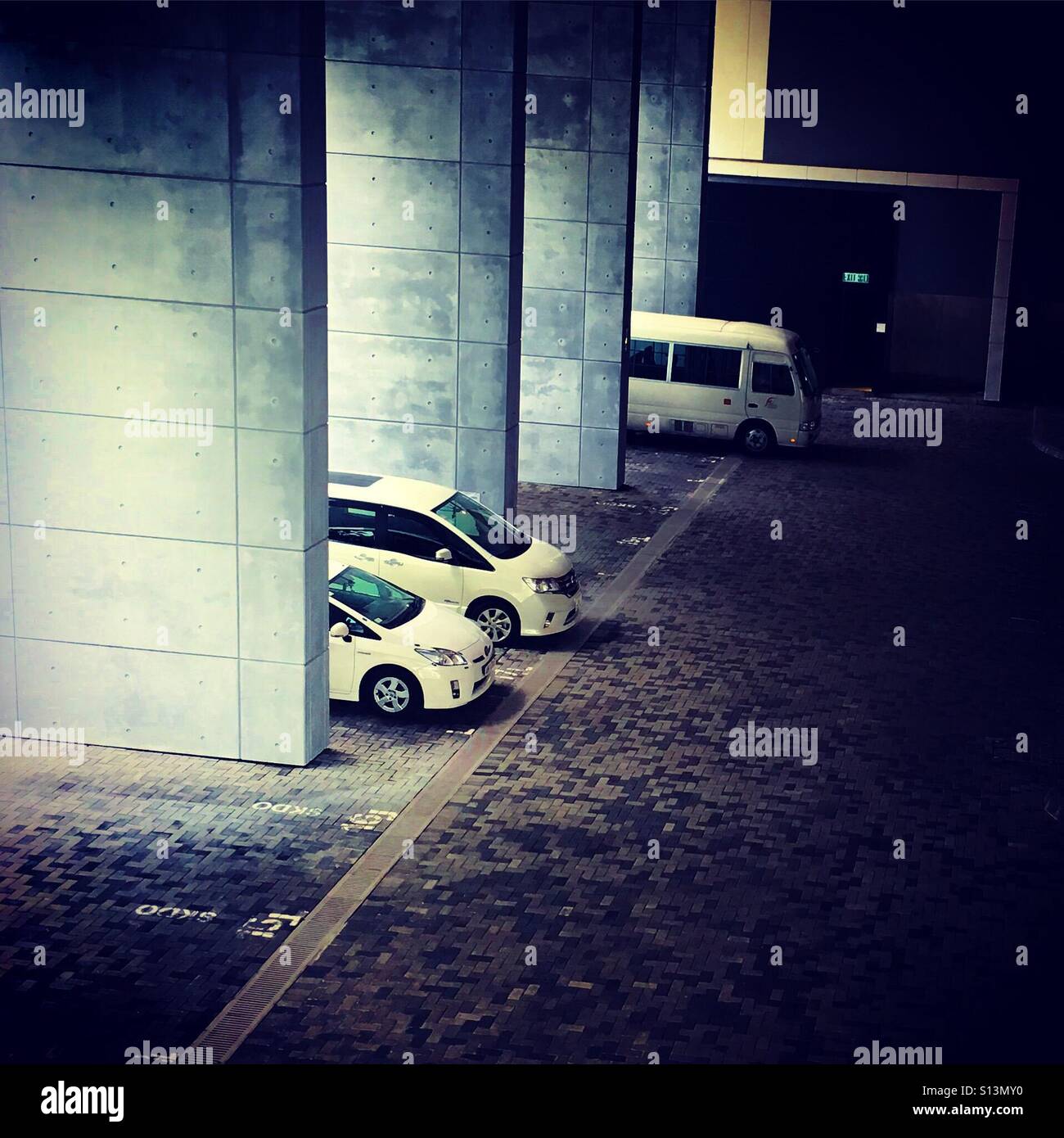 3 vehicules in large parking - Smartphone Captured Stock Image