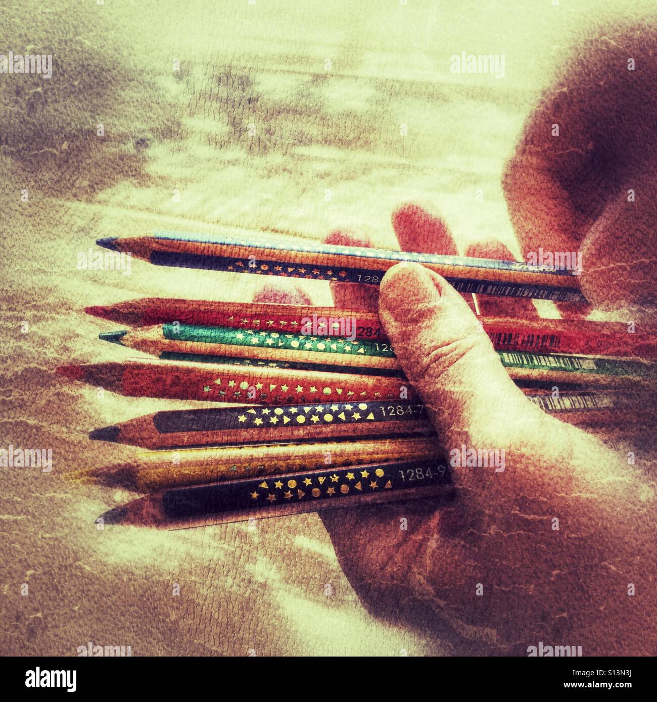 Choosing a colour pencil - Smartphone Captured Stock Image