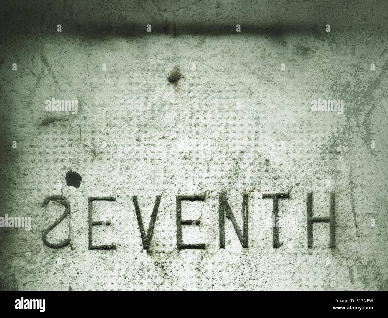 Seventh: an error in a concrete stamp. - Smartphone Captured Stock Image
