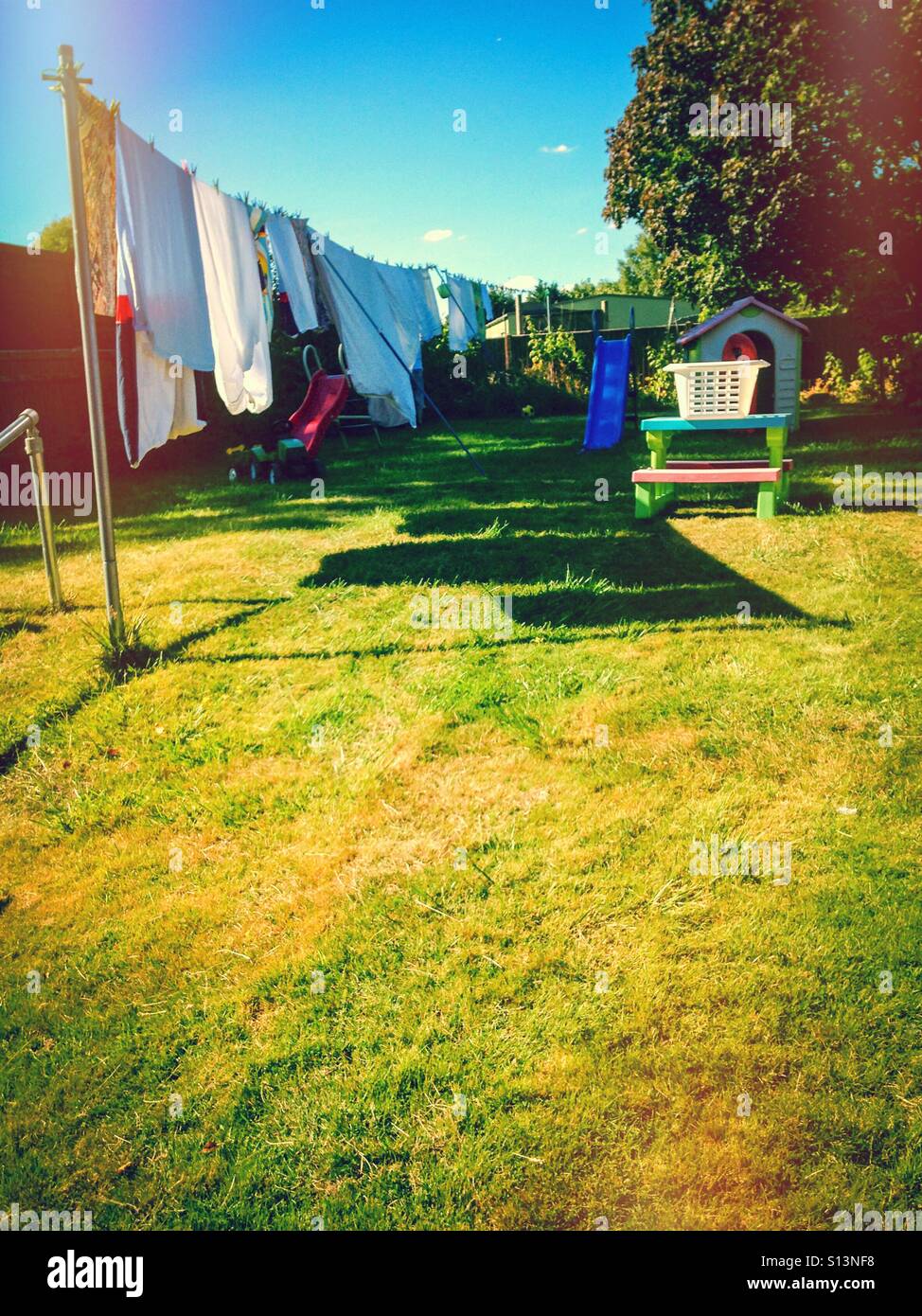 Washing drying on the washing line in the back garden. - Smartphone Captured Stock Image