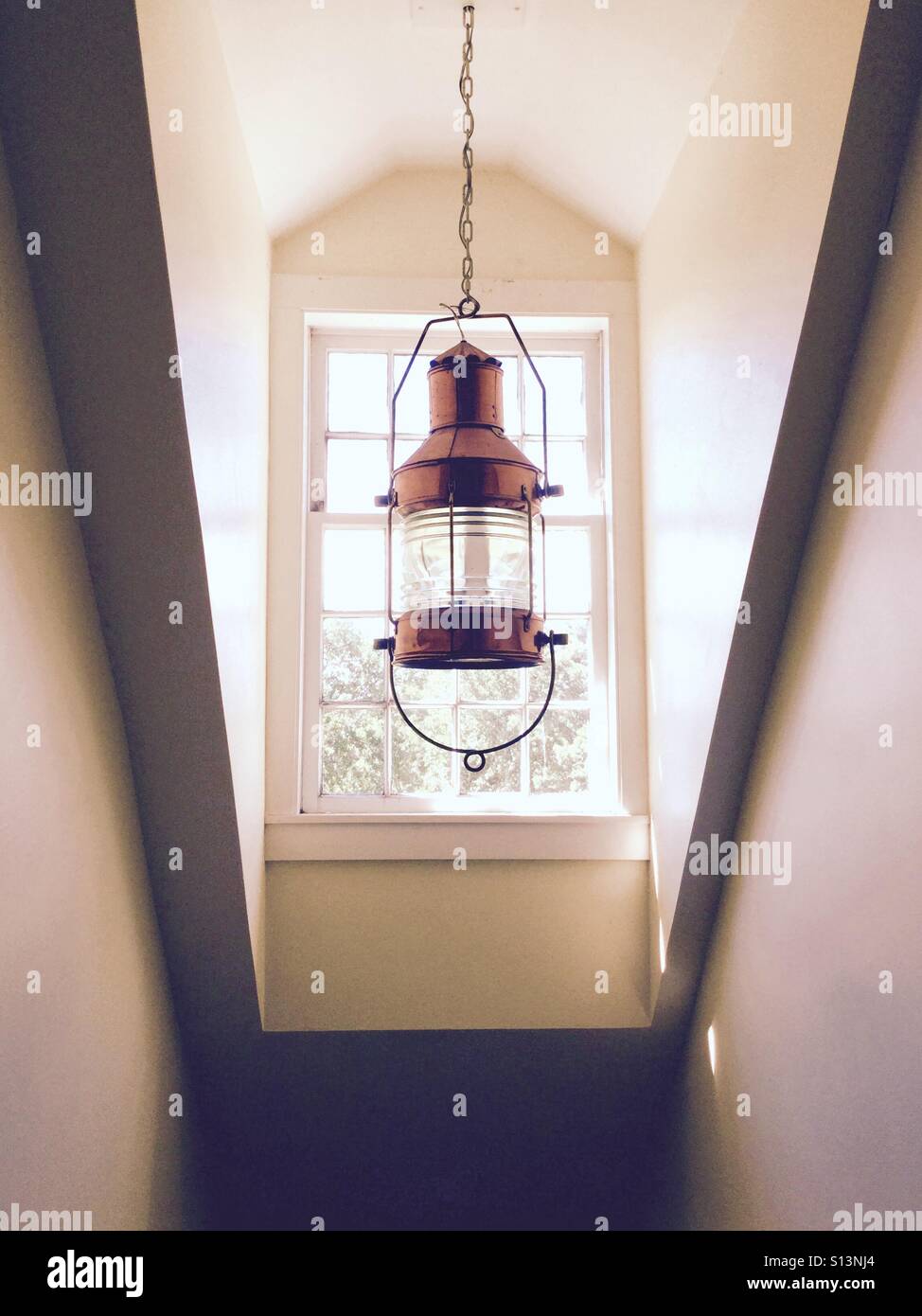 Copper nautical style hanging lamp in a stairwell Stock Photo Alamy