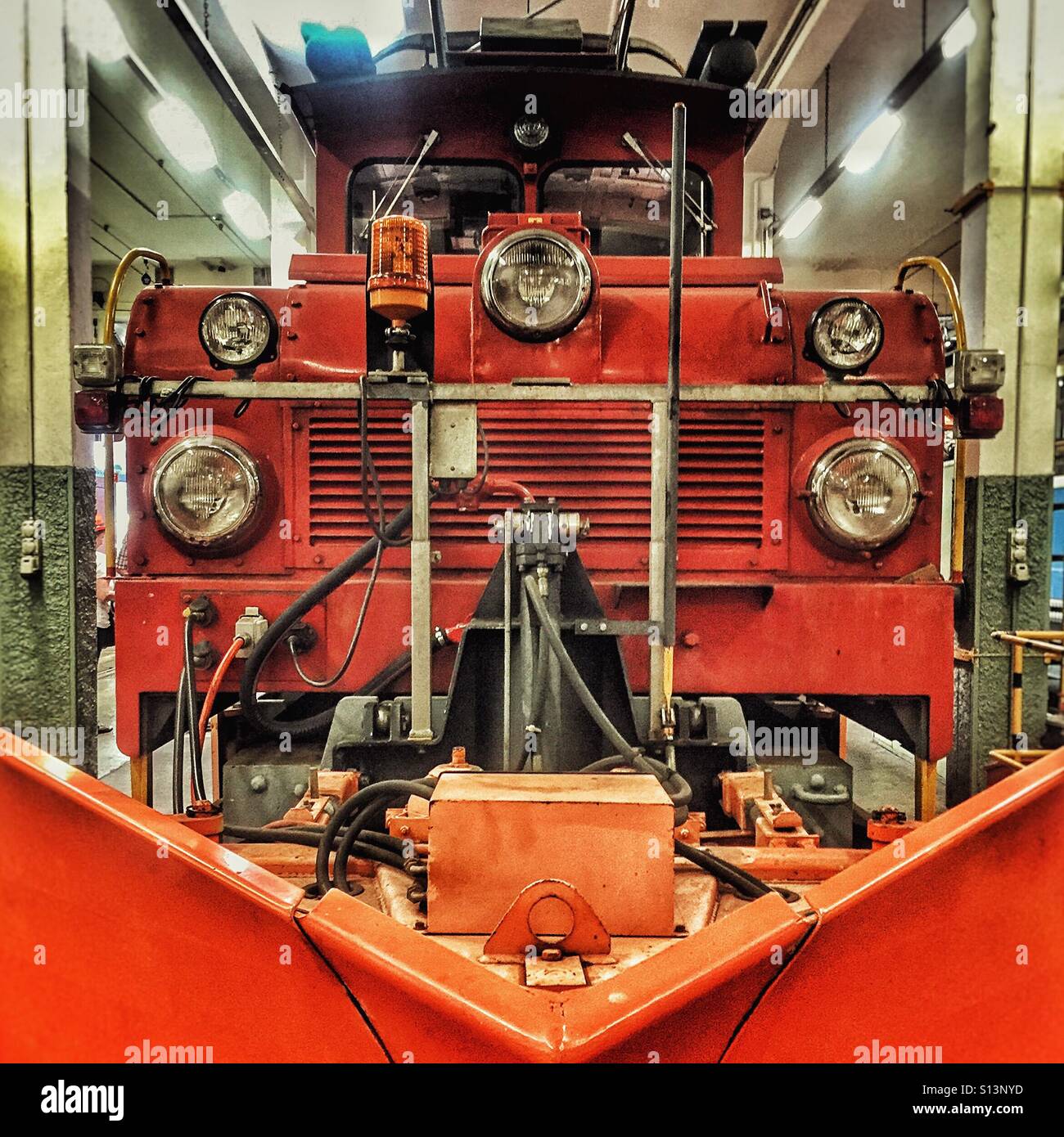 Orange snowplough locomotive on Swiss RBS network - Smartphone Captured Stock Image