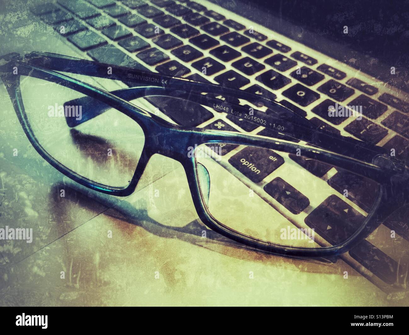Glasses on a laptop - Smartphone Captured Stock Image