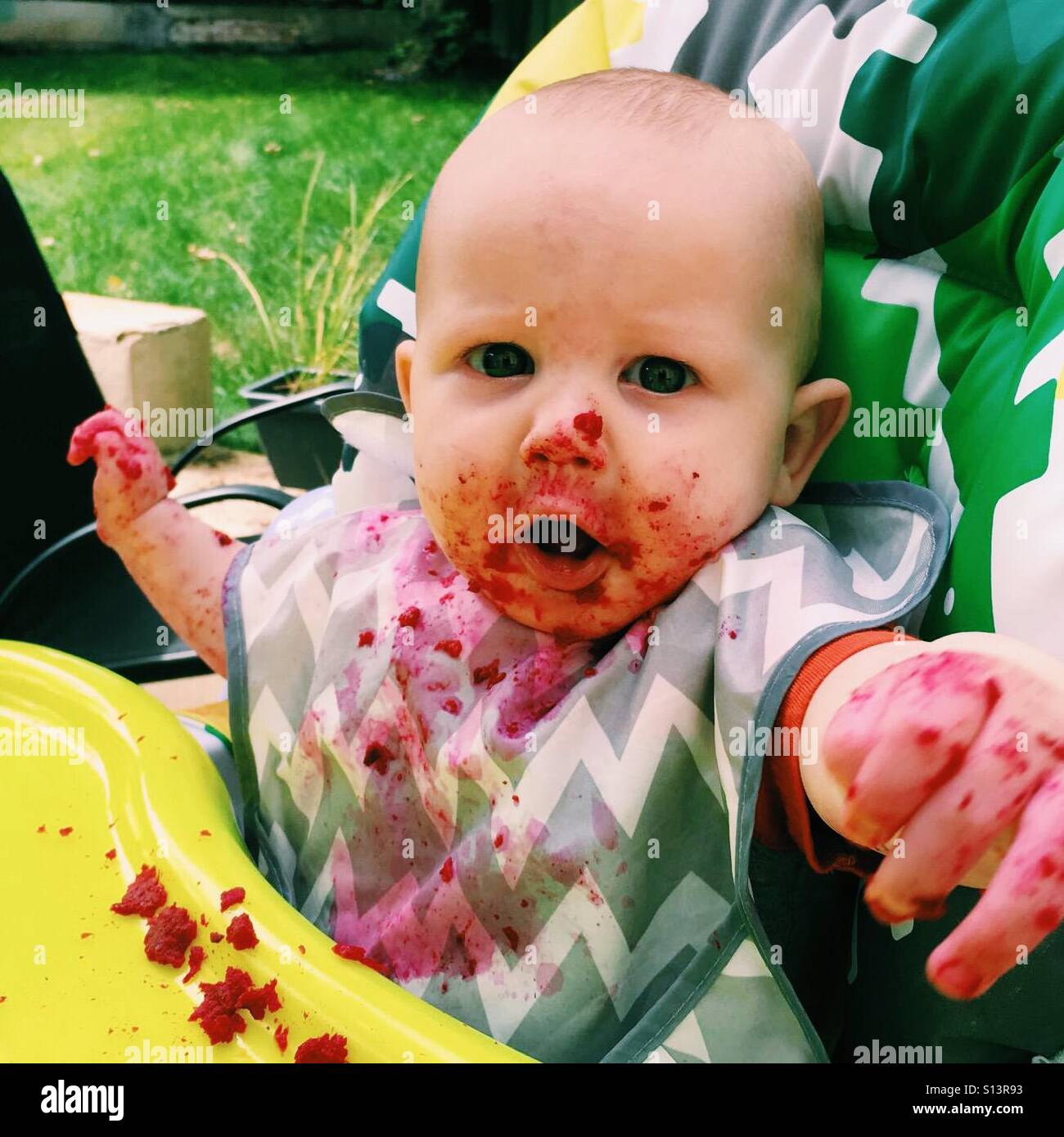 Messy baby eating Stock Photo