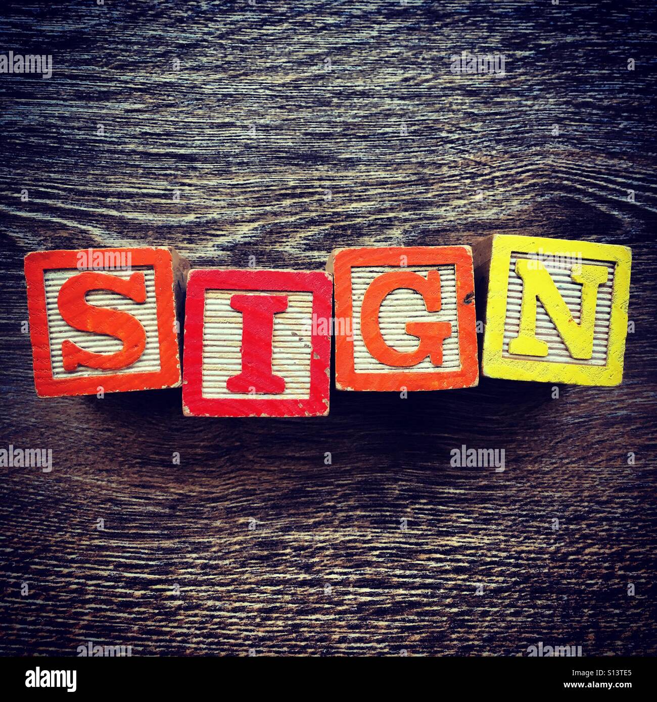 SIGN word written with wood block letter toys - Smartphone Captured Stock Image