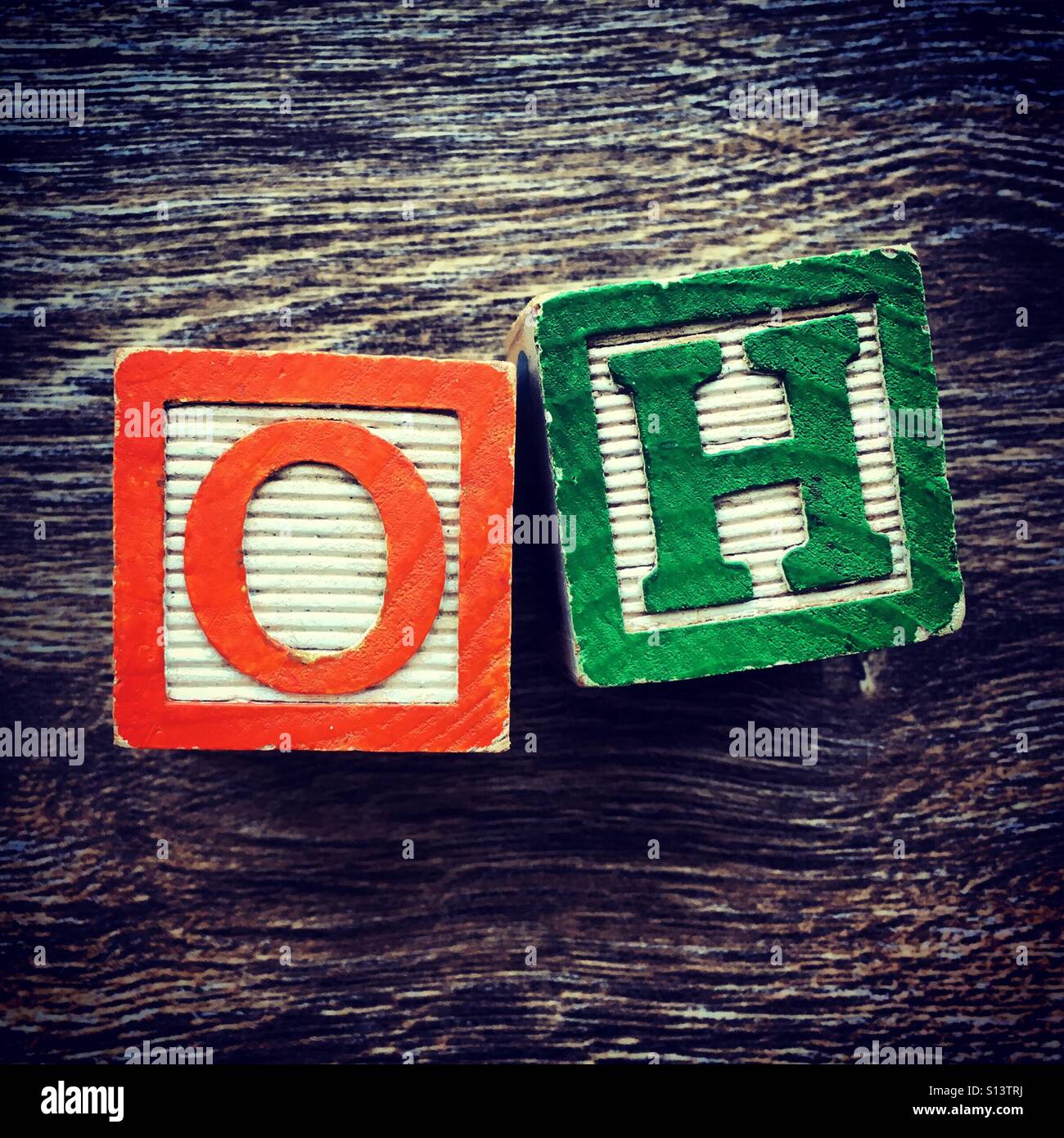 OH word written with wood block letter toys - Smartphone Captured Stock Image