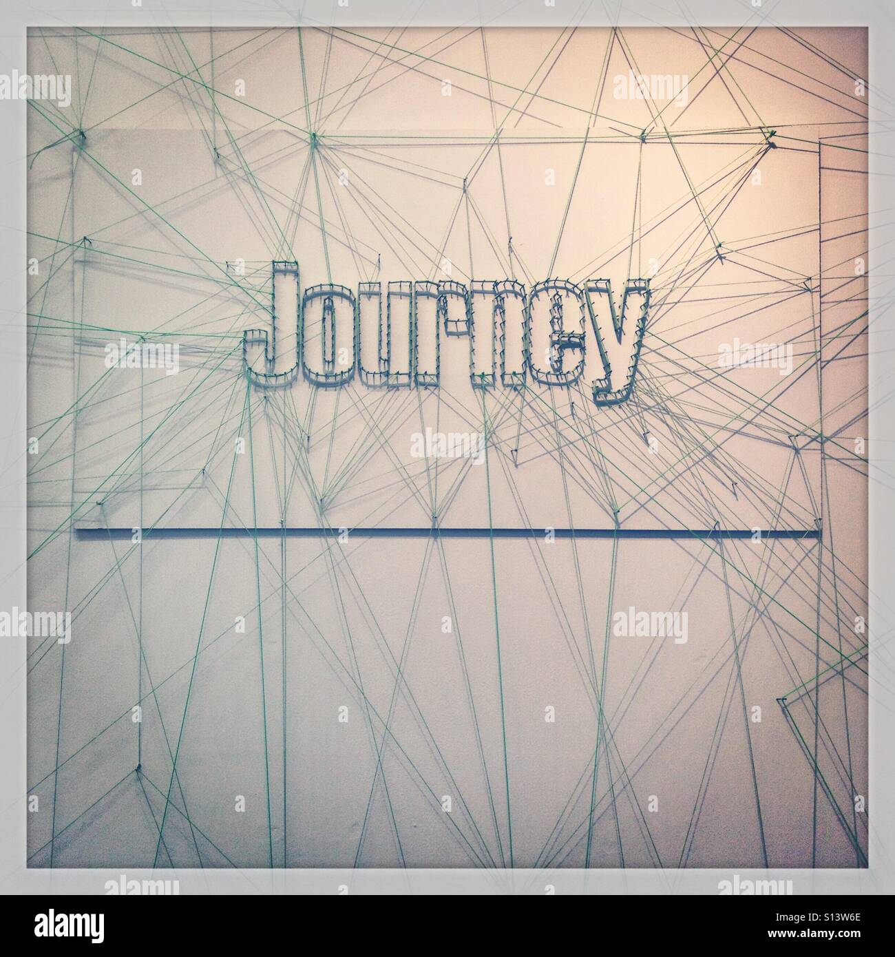 The word Journey made from pins and string Stock Photo