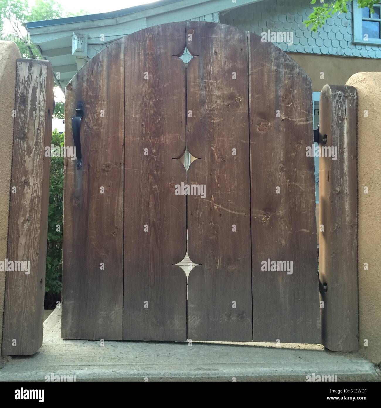 Wooden gate in a back yard. Stock Photo