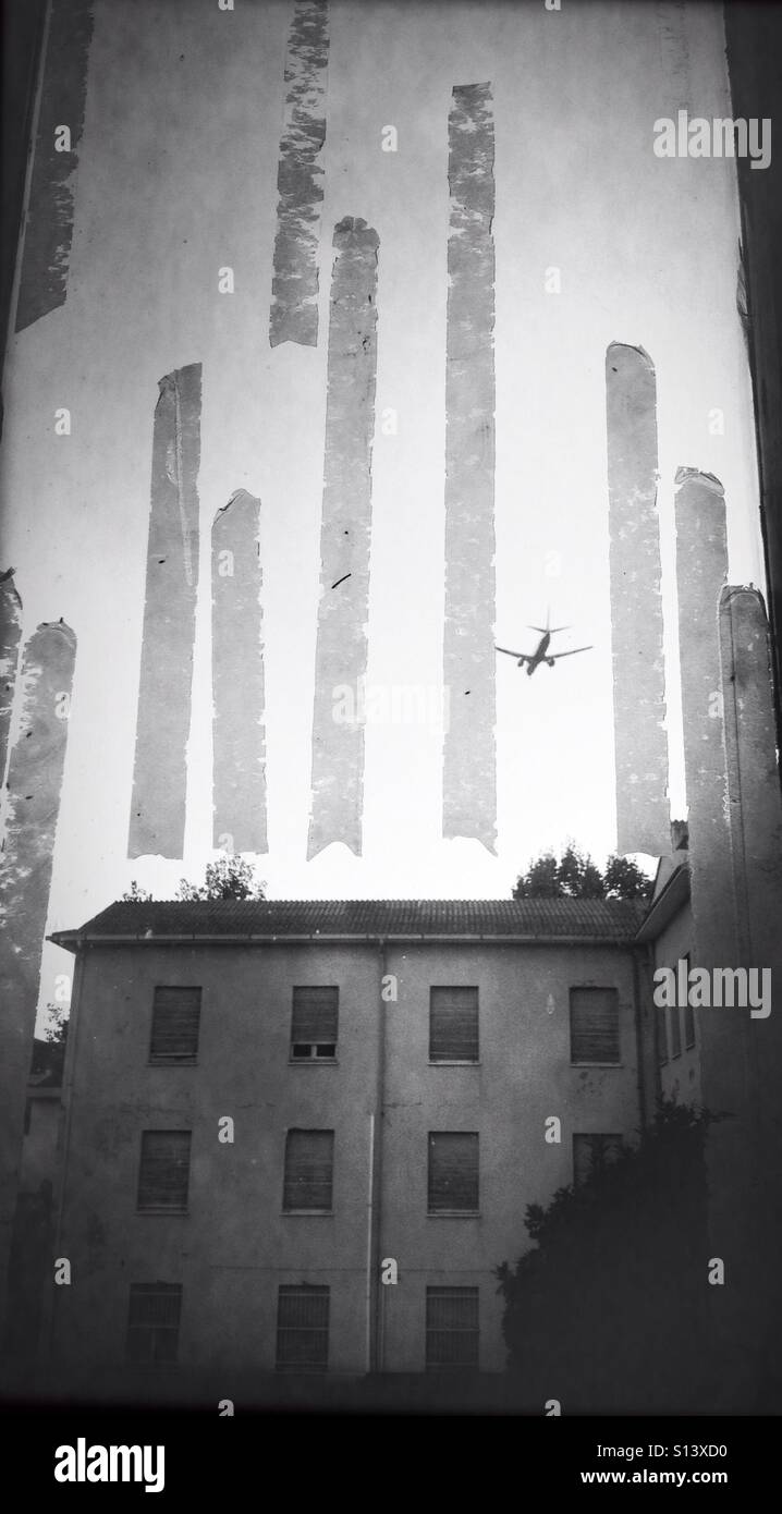 Window adhesive tape on glass view plane flying freedom concept abandoned building outside departure abandon separation ban banned flight - Smartphone Captured Stock Image